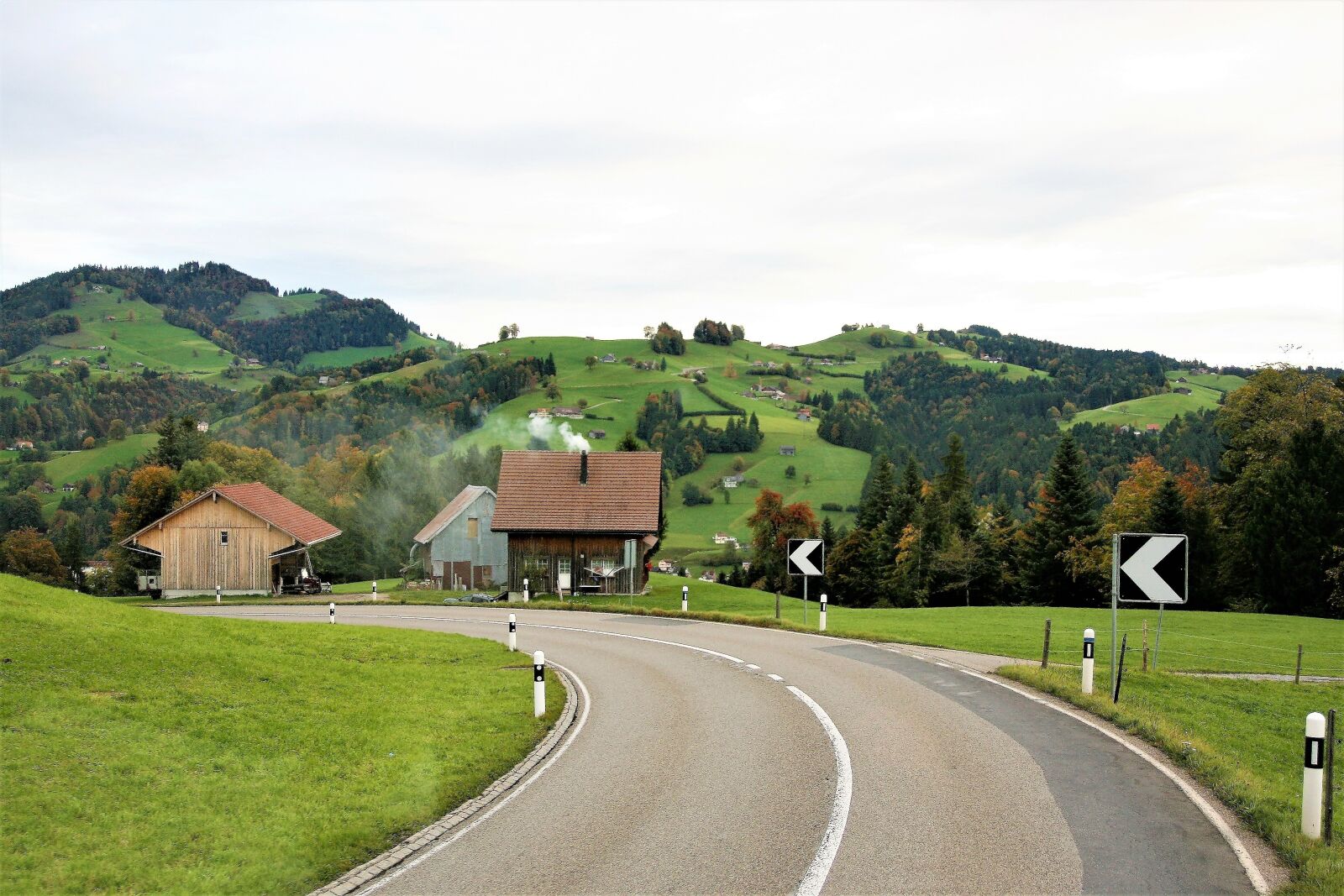 Canon EOS 400D (EOS Digital Rebel XTi / EOS Kiss Digital X) sample photo. Hills, highway, mountain village photography