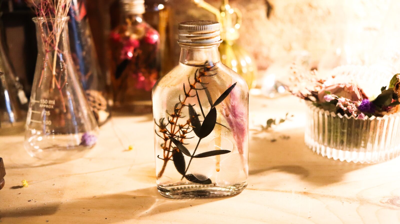 Canon EF-S 24mm F2.8 STM sample photo. Ornament, glass bottles, oil photography