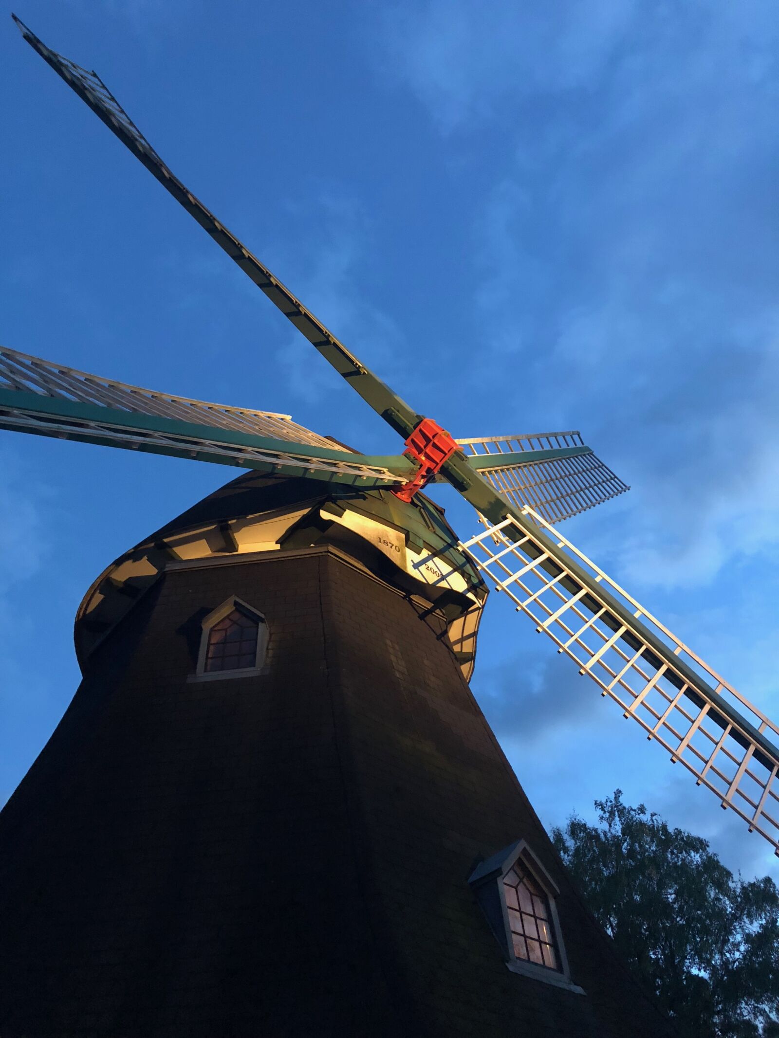 iPhone X back dual camera 4mm f/1.8 sample photo. Windmill, wing, sky photography