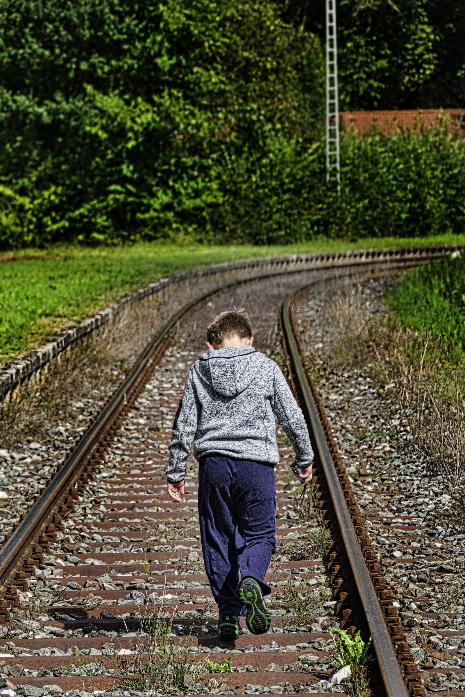 Panasonic Lumix DMC-FZ1000 sample photo. Rails, boy, irresponsible photography