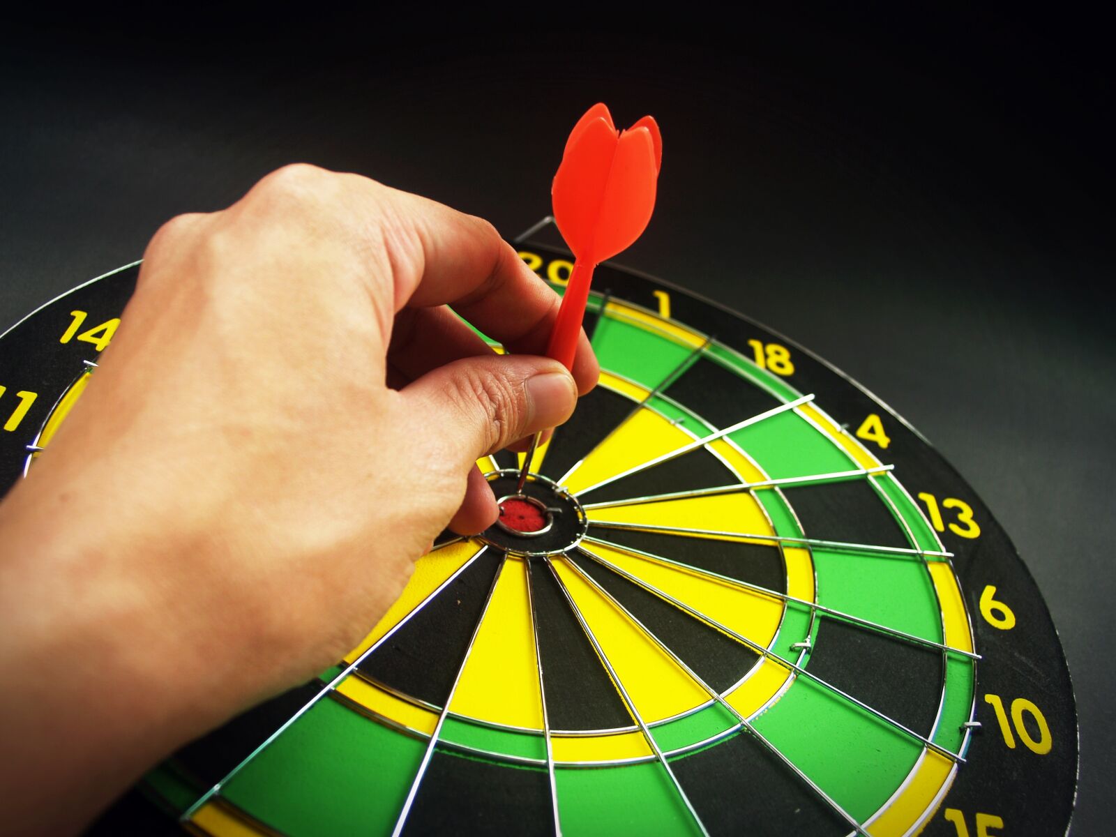 Olympus E-300 (EVOLT E-300) sample photo. Person, holding, red, dart photography