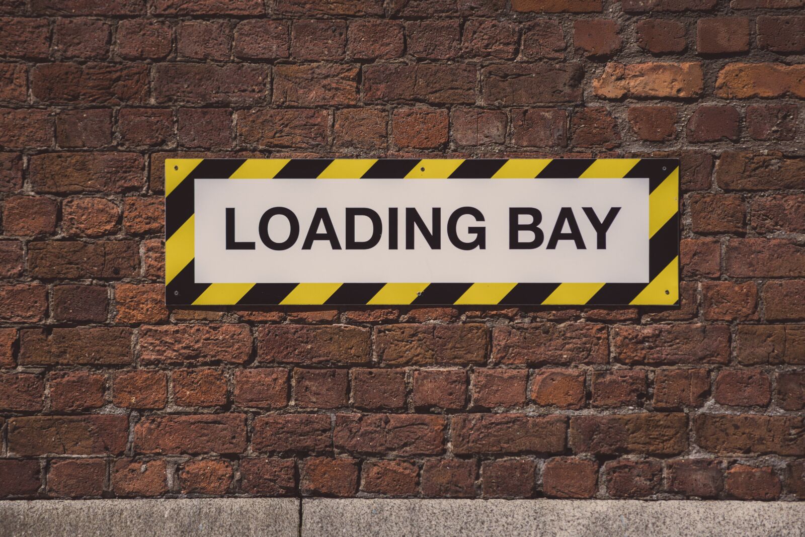 Nikon D750 sample photo. Loading bay, sign, street photography