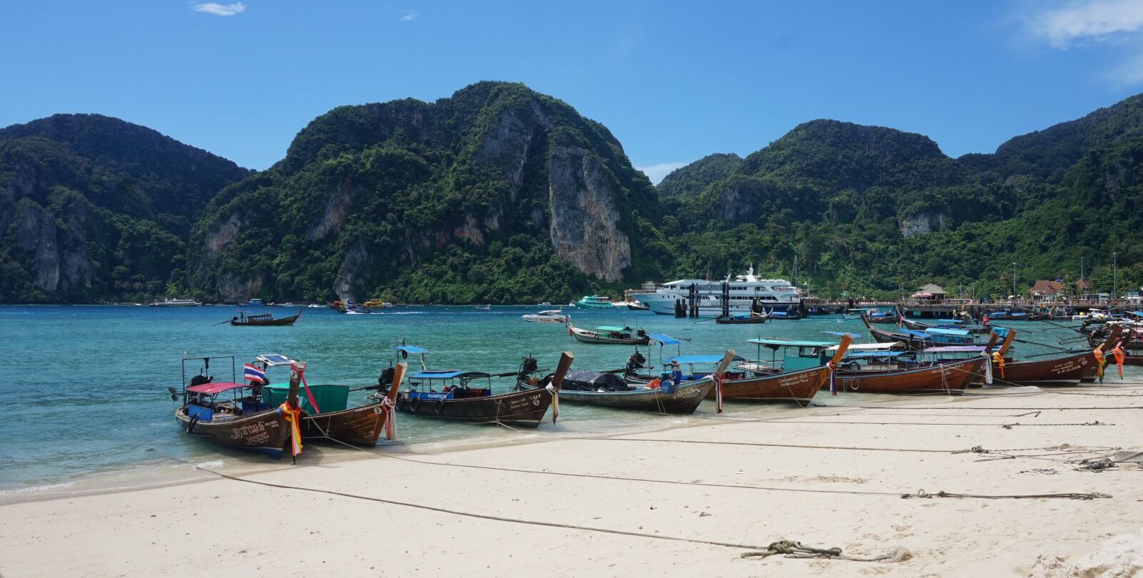 Sony Alpha a5000 (ILCE 5000) sample photo. Boats, beach, mountains photography