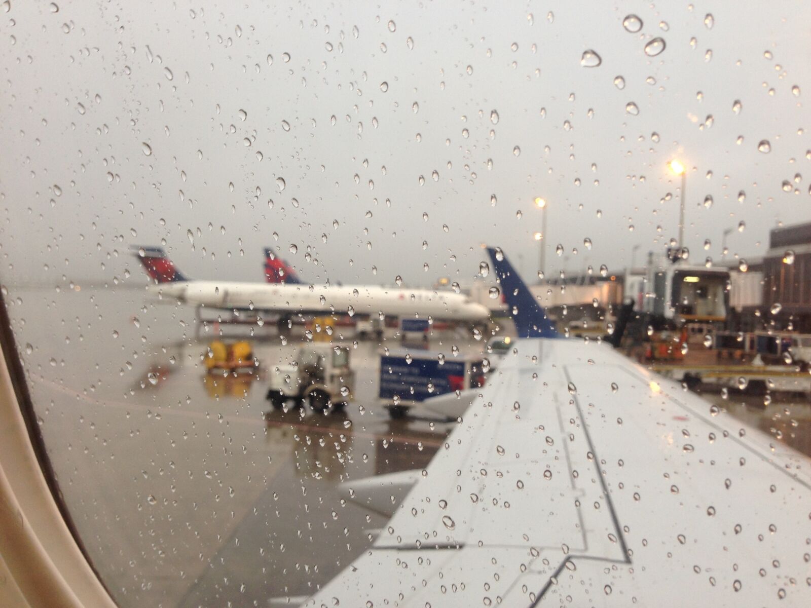 Apple iPhone 5 sample photo. Travel, airplane, rainy day photography