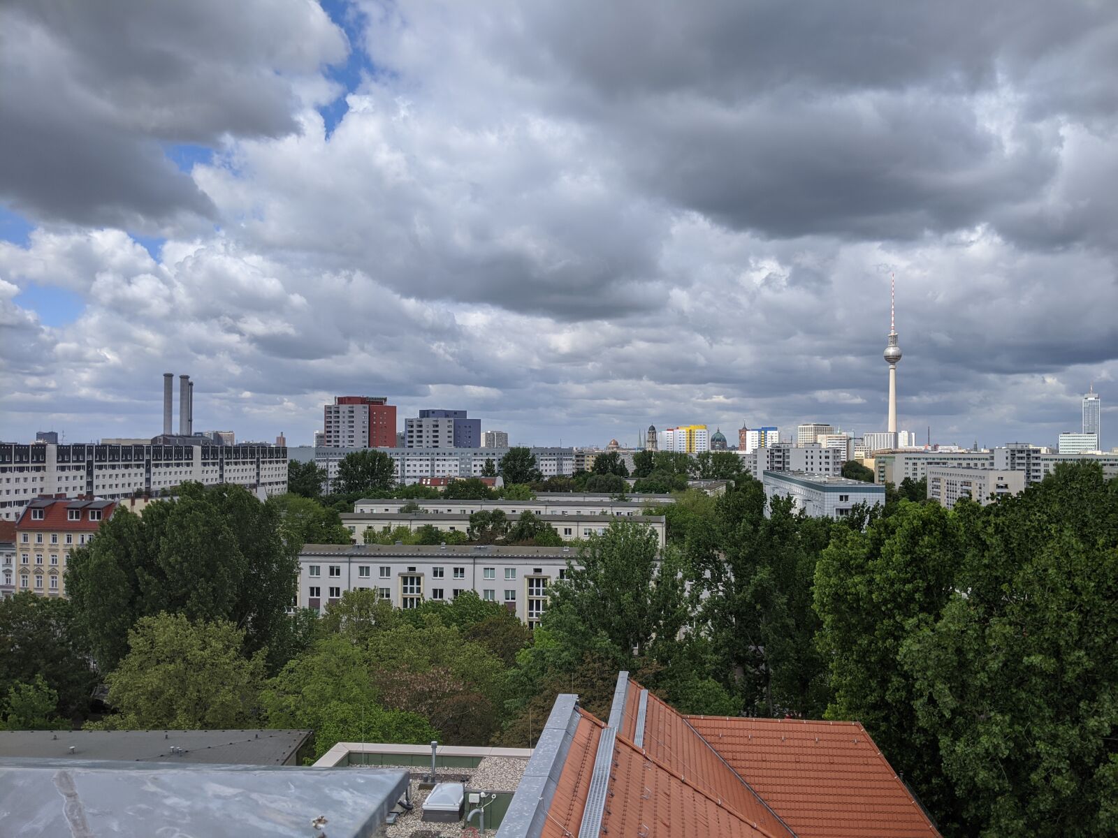 Google Pixel 3a sample photo. Berlin, roof, clouds photography