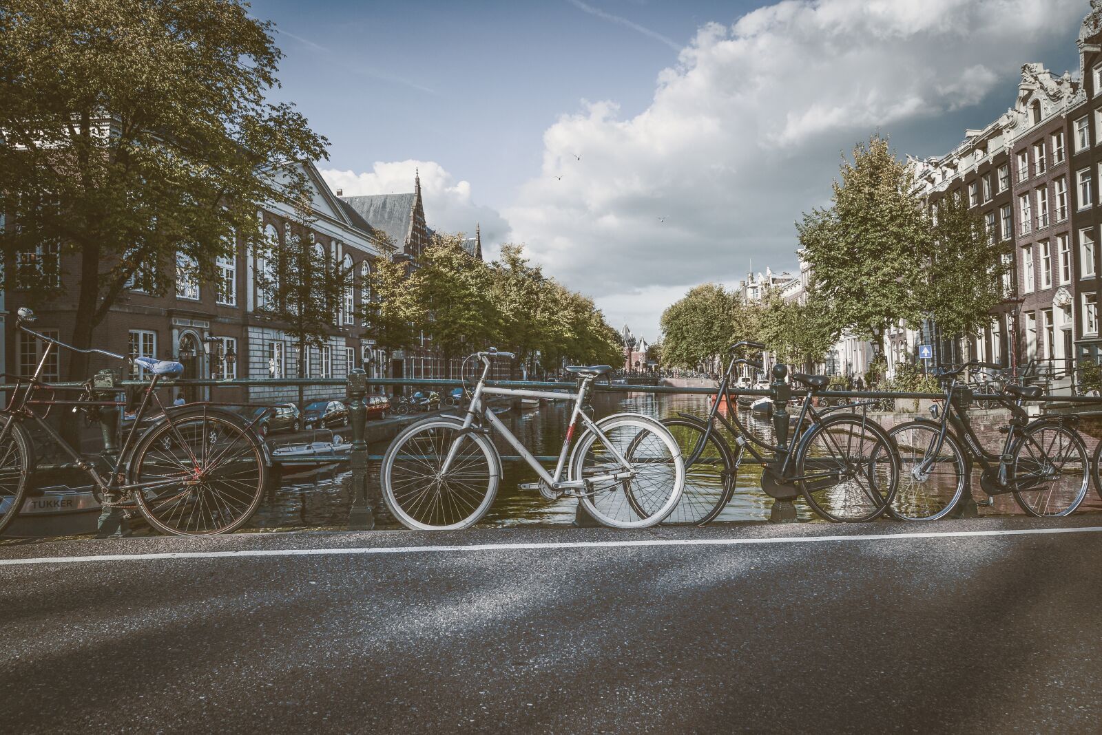 Nikon D610 sample photo. Bicycles, clouds, amsterdam photography