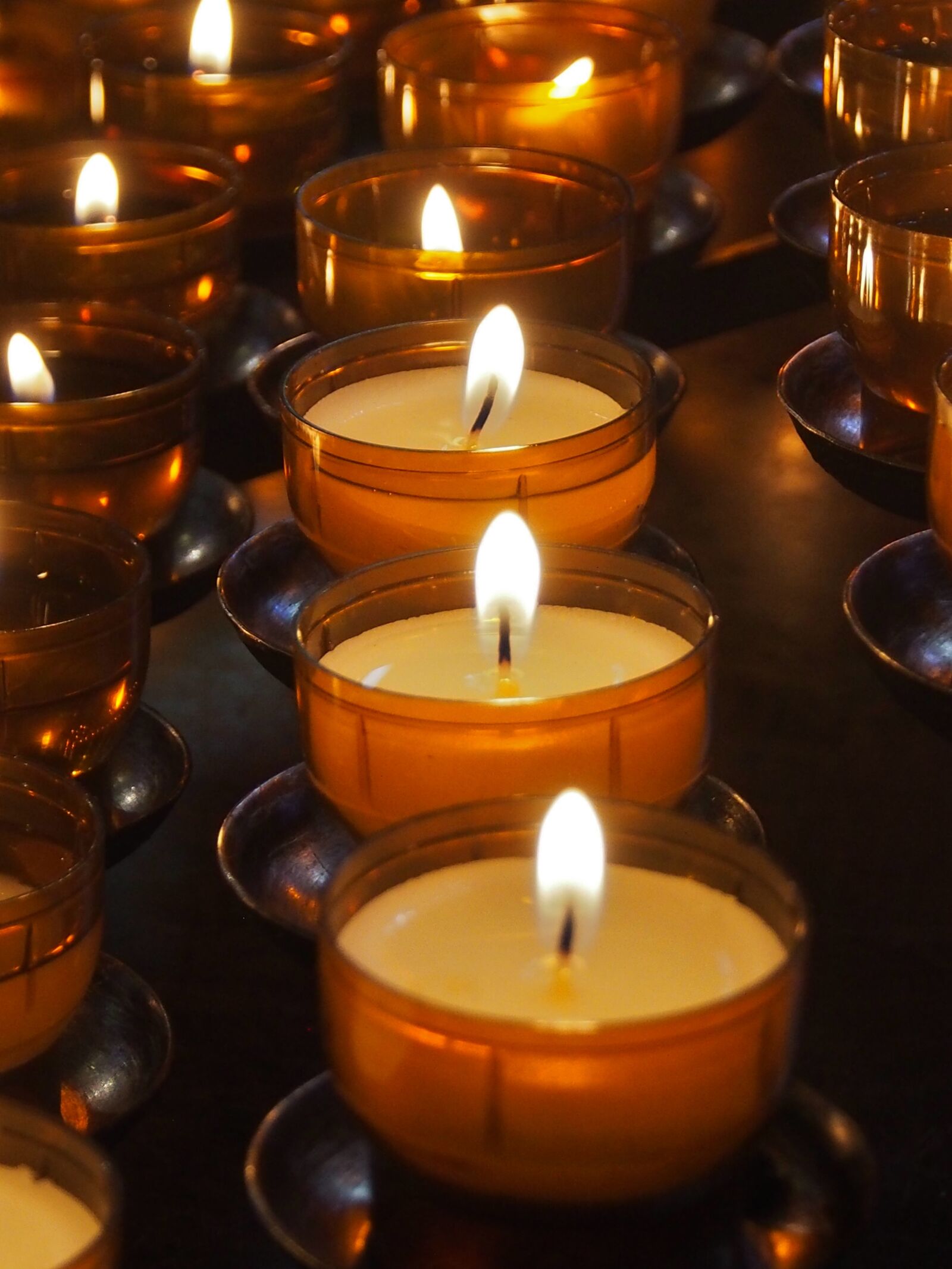 Olympus OM-D E-M5 sample photo. Candle, votive light, religion photography