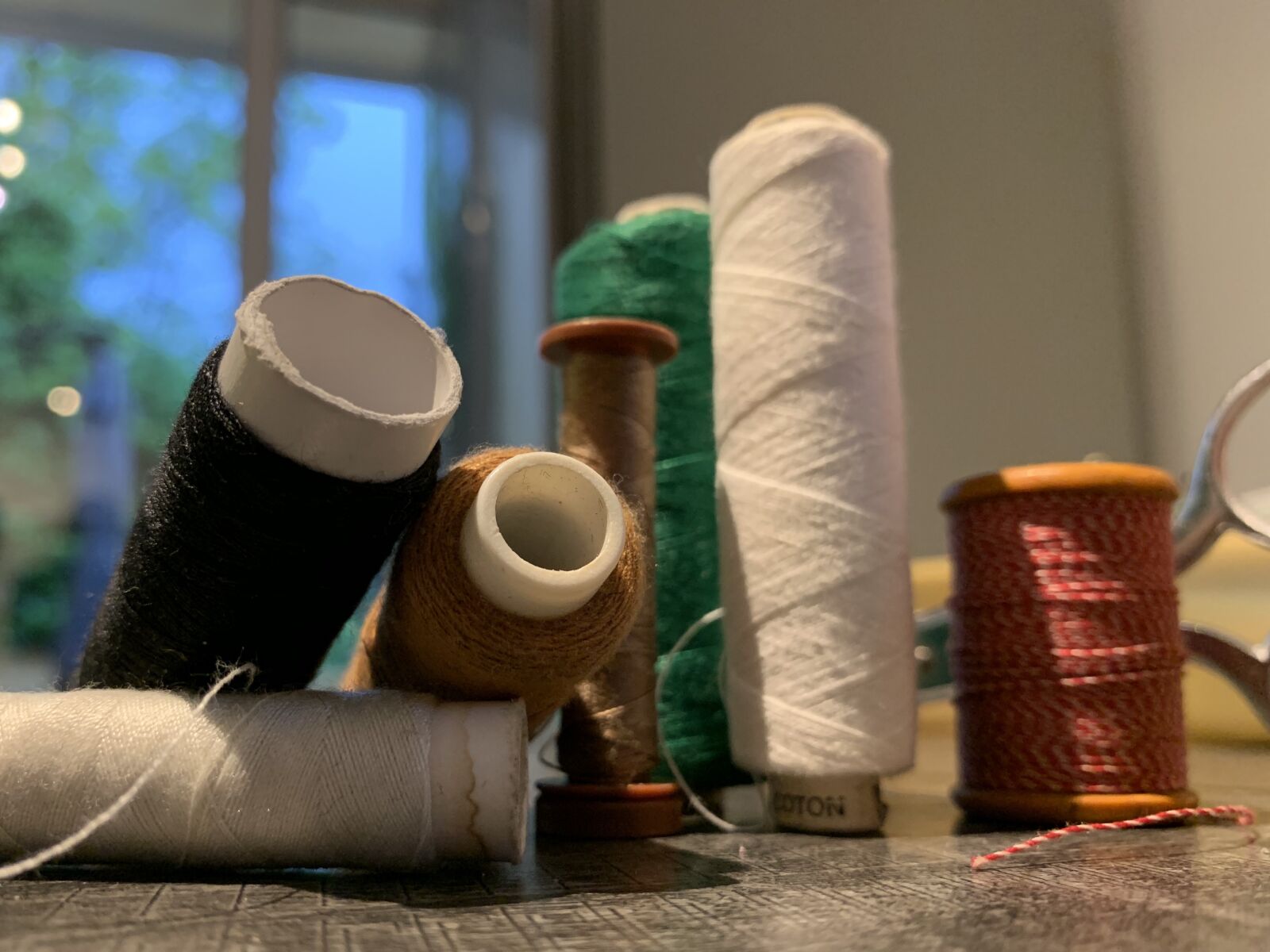 Apple iPhone XR sample photo. Spools of thread, chisel photography