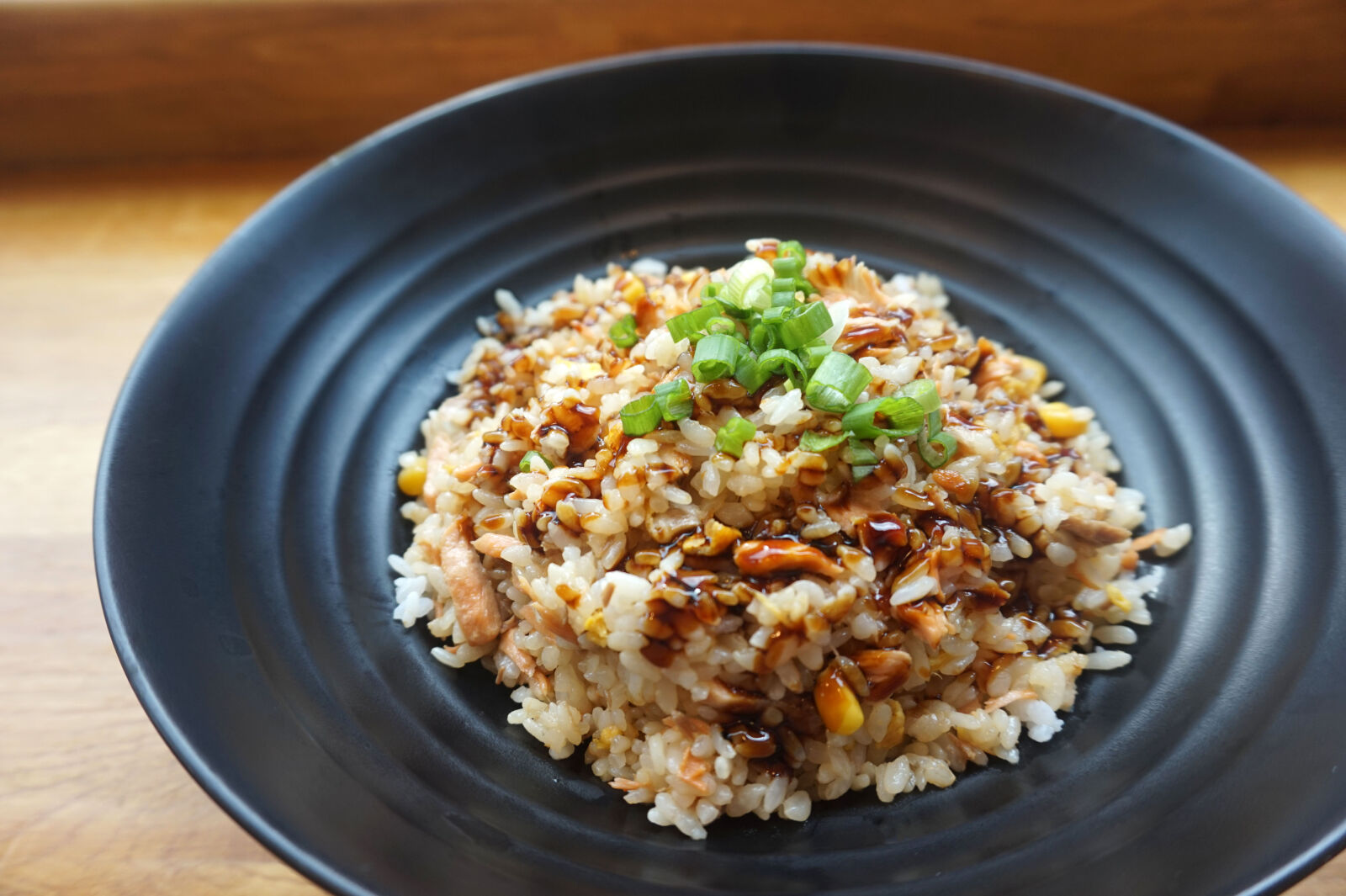 Sony Alpha a5000 (ILCE 5000) sample photo. Cooked, rice, on, black photography