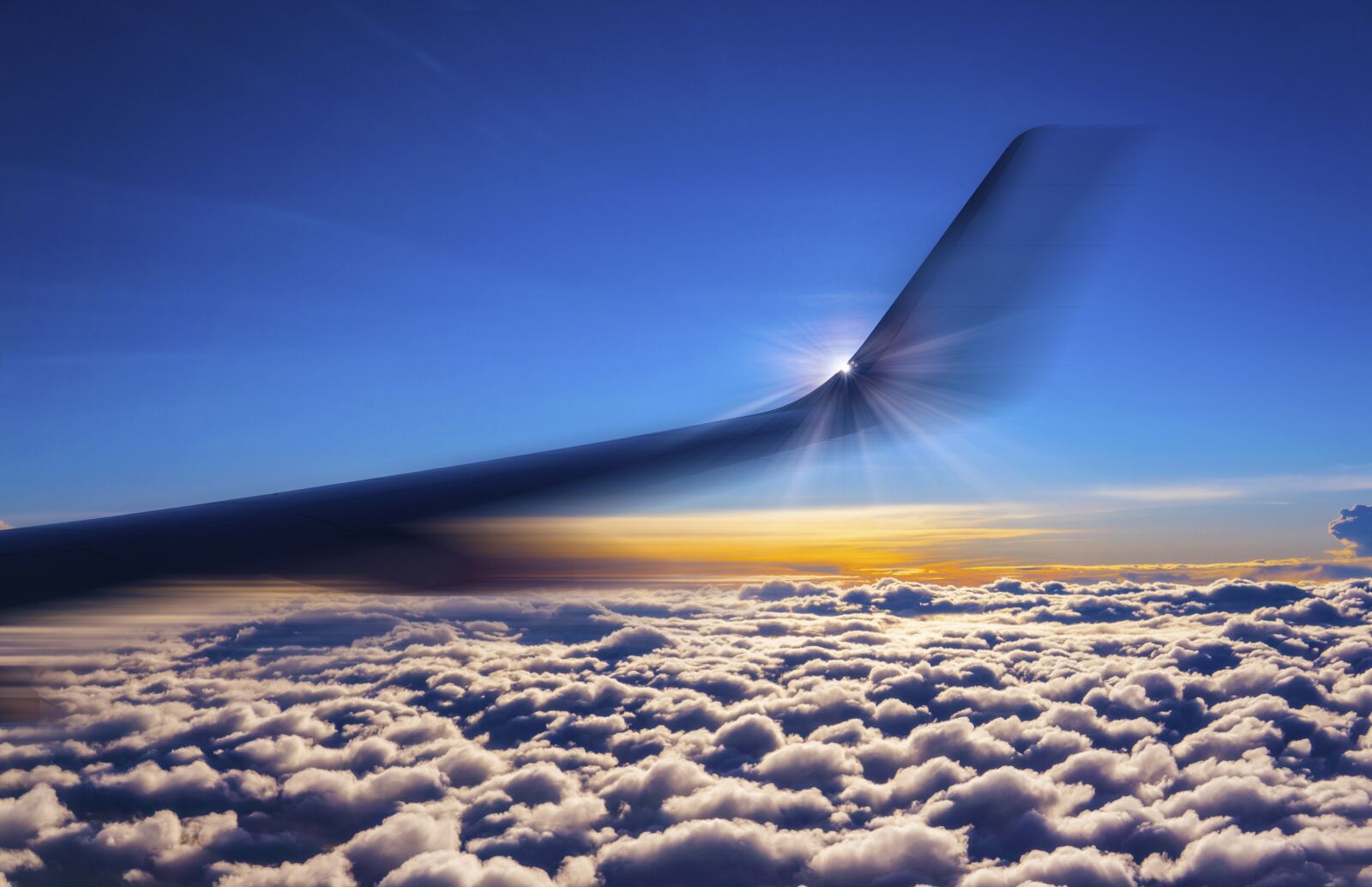 30mm F1.4 DC DN | Contemporary 016 sample photo. Airplane, above the clouds photography