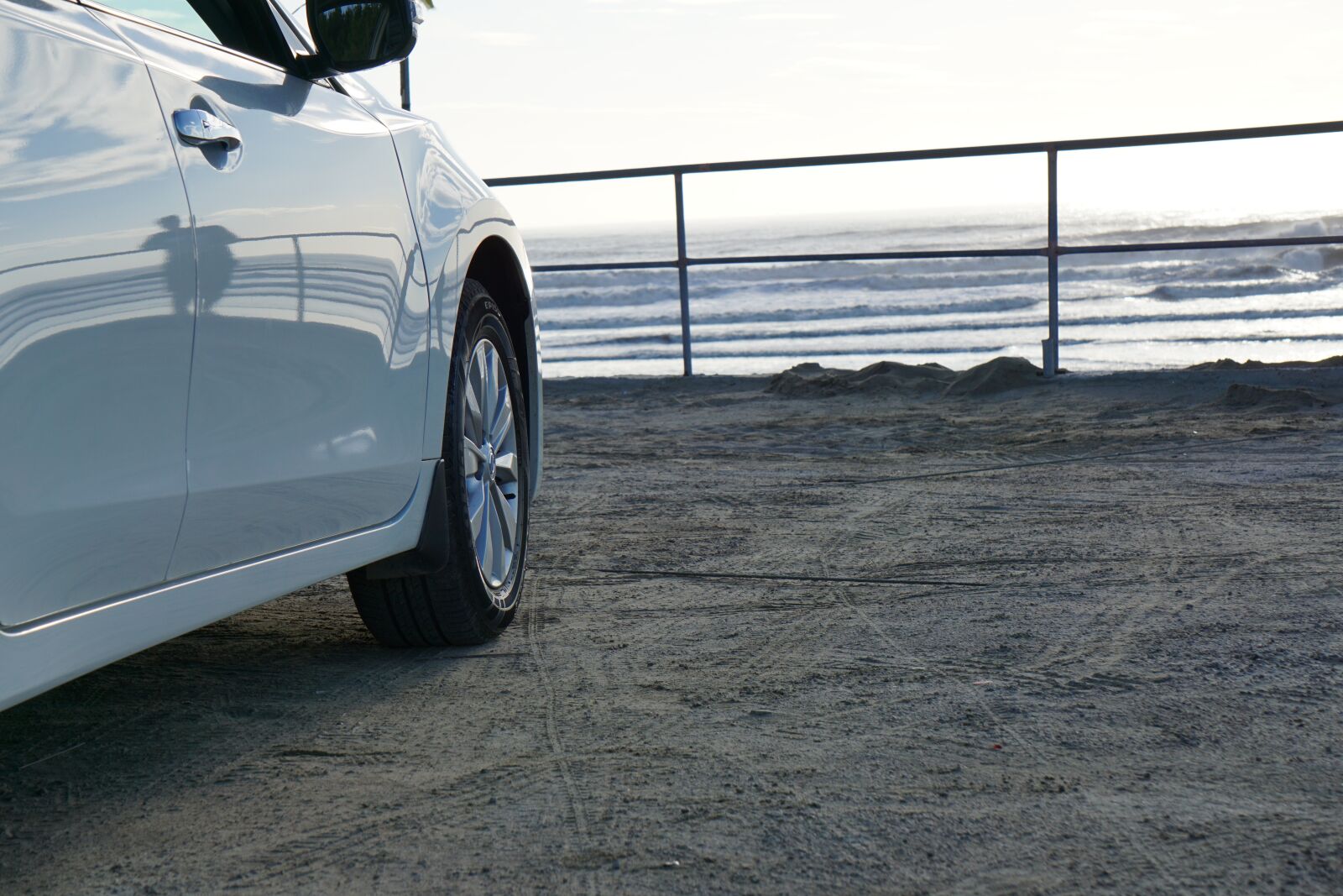 Sony E 55-210mm F4.5-6.3 OSS sample photo. White, car, sea photography