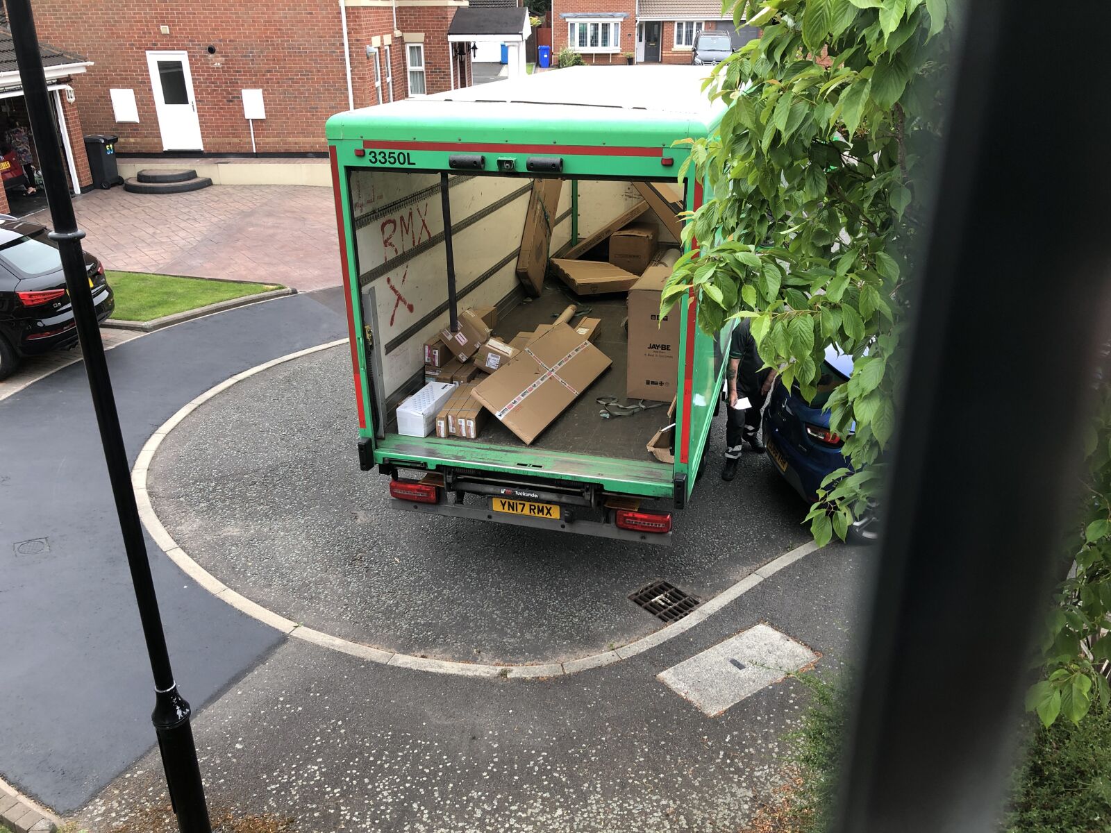 iPhone X back dual camera 4mm f/1.8 sample photo. Delivery van, parcels, courier photography