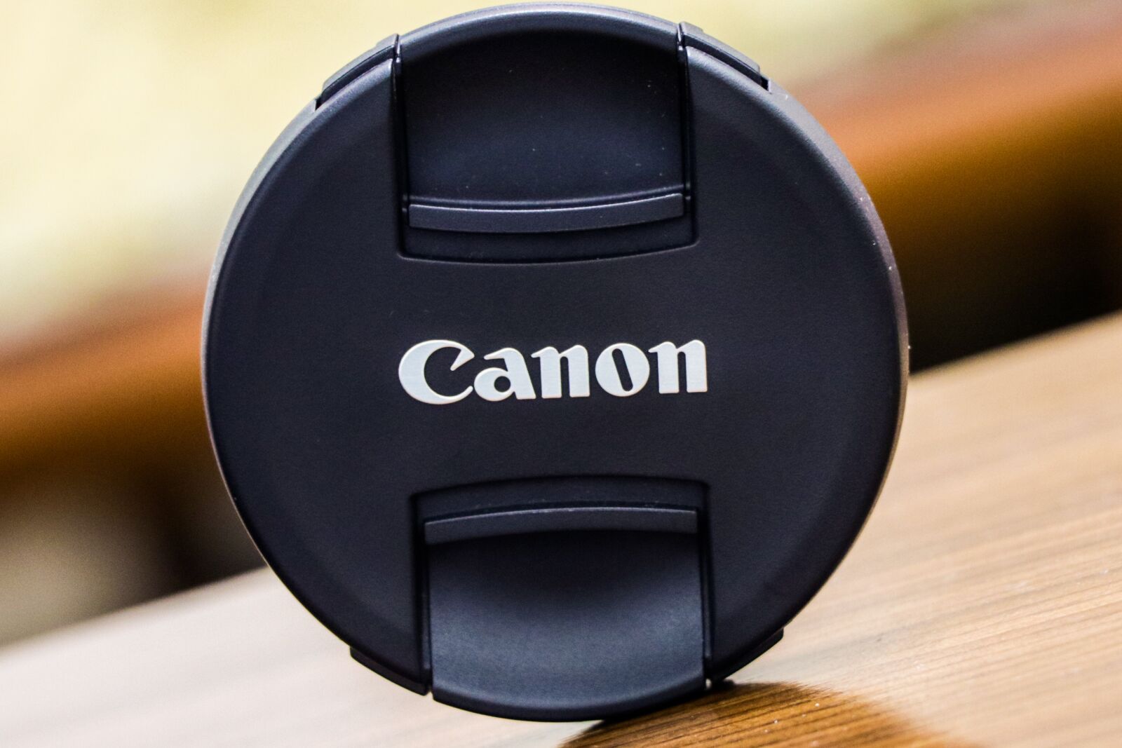Canon EF-S 18-135mm F3.5-5.6 IS USM sample photo. Canon, cap, blurry background photography