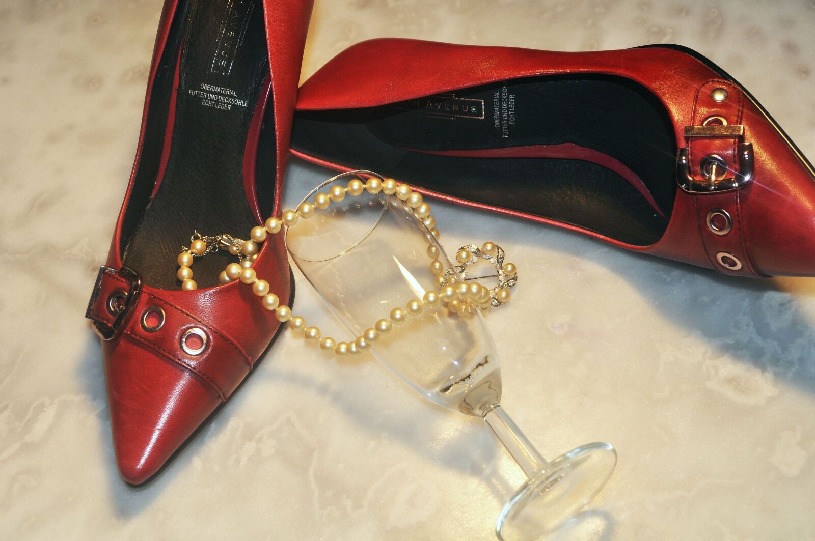 Nikon D5000 sample photo. Red boots, glass, beads photography