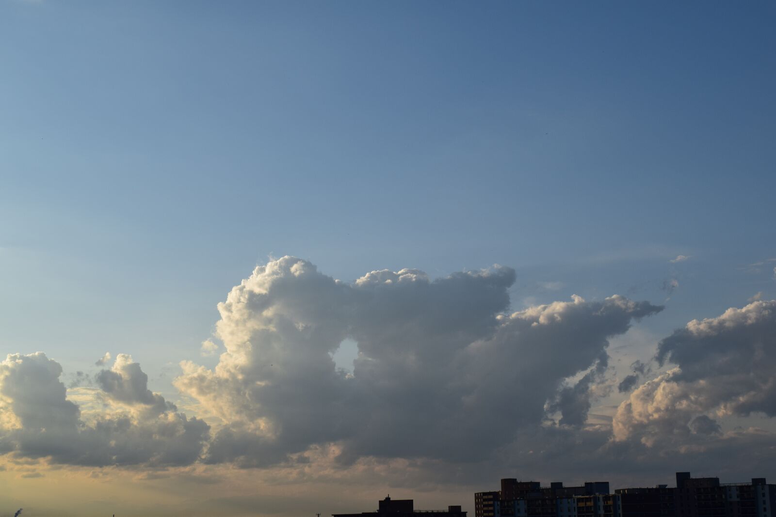 Nikon D5300 sample photo. Clouds, city, skies photography