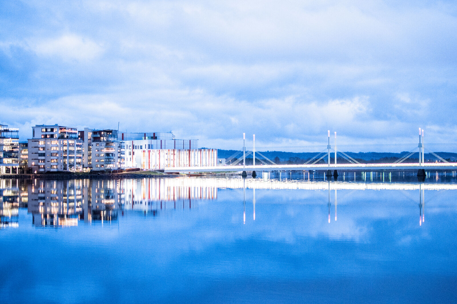 Nikon D90 + Nikon AF-S DX Nikkor 35mm F1.8G sample photo. Bridge, buildings, city, clouds photography