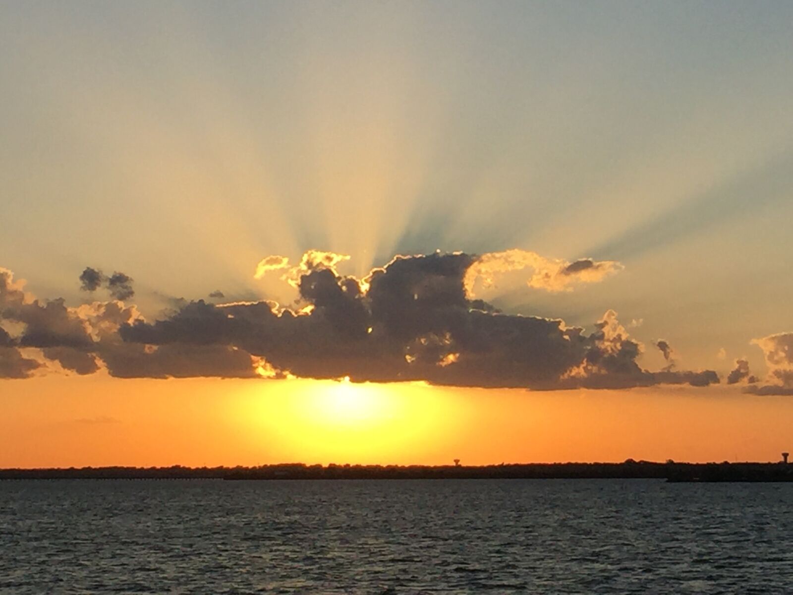 Apple iPhone 6 sample photo. Sunset, water, boat photography
