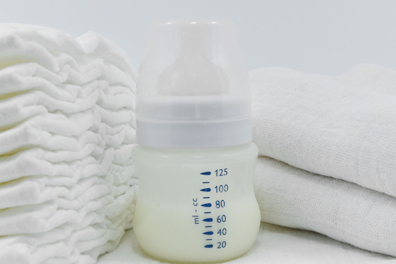 Nikon D5500 sample photo. Bottle, diaper, milk, merchandise photography