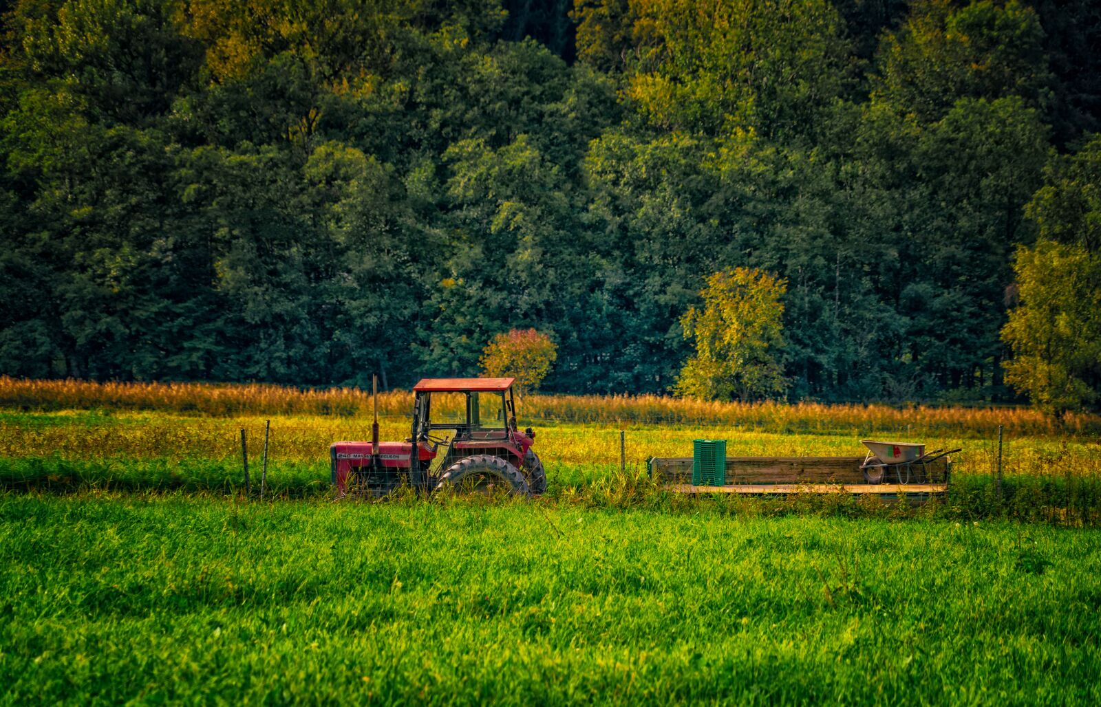 Sony a7R II sample photo. Field, tractor, trailers photography