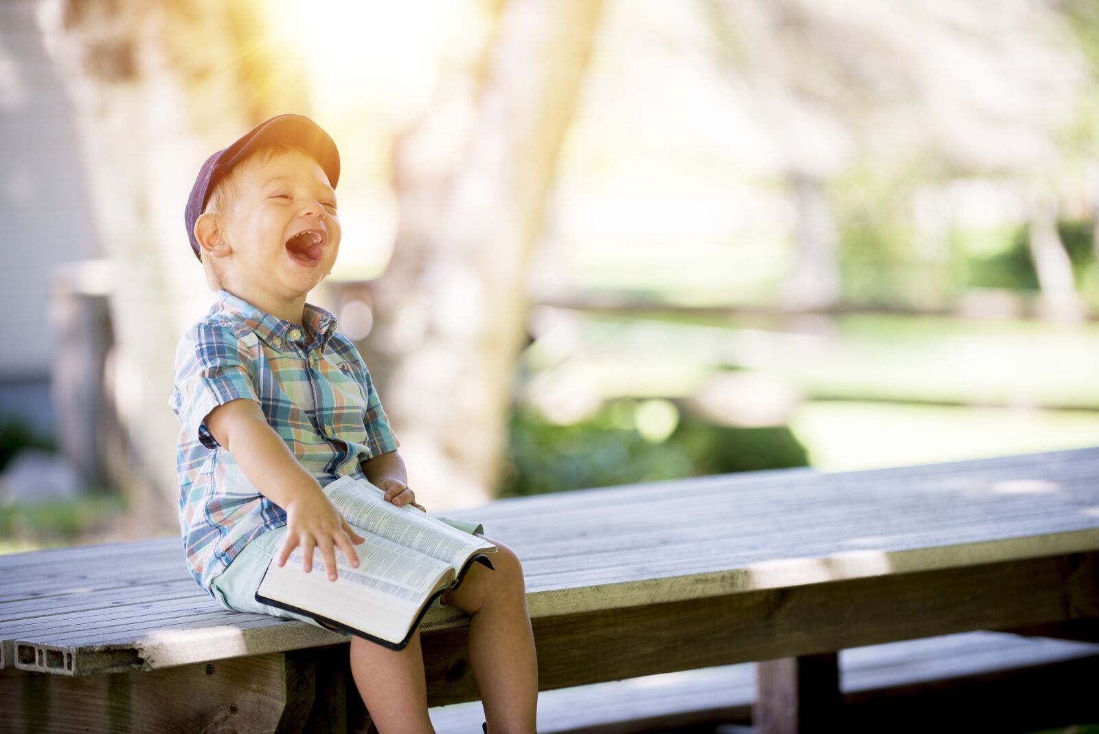 Nikon D750 sample photo. Boy, laughing, reading photography