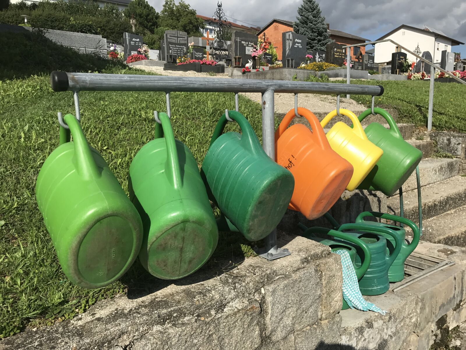 iPhone 7 back camera 3.99mm f/1.8 sample photo. Watering can, colorful, water photography
