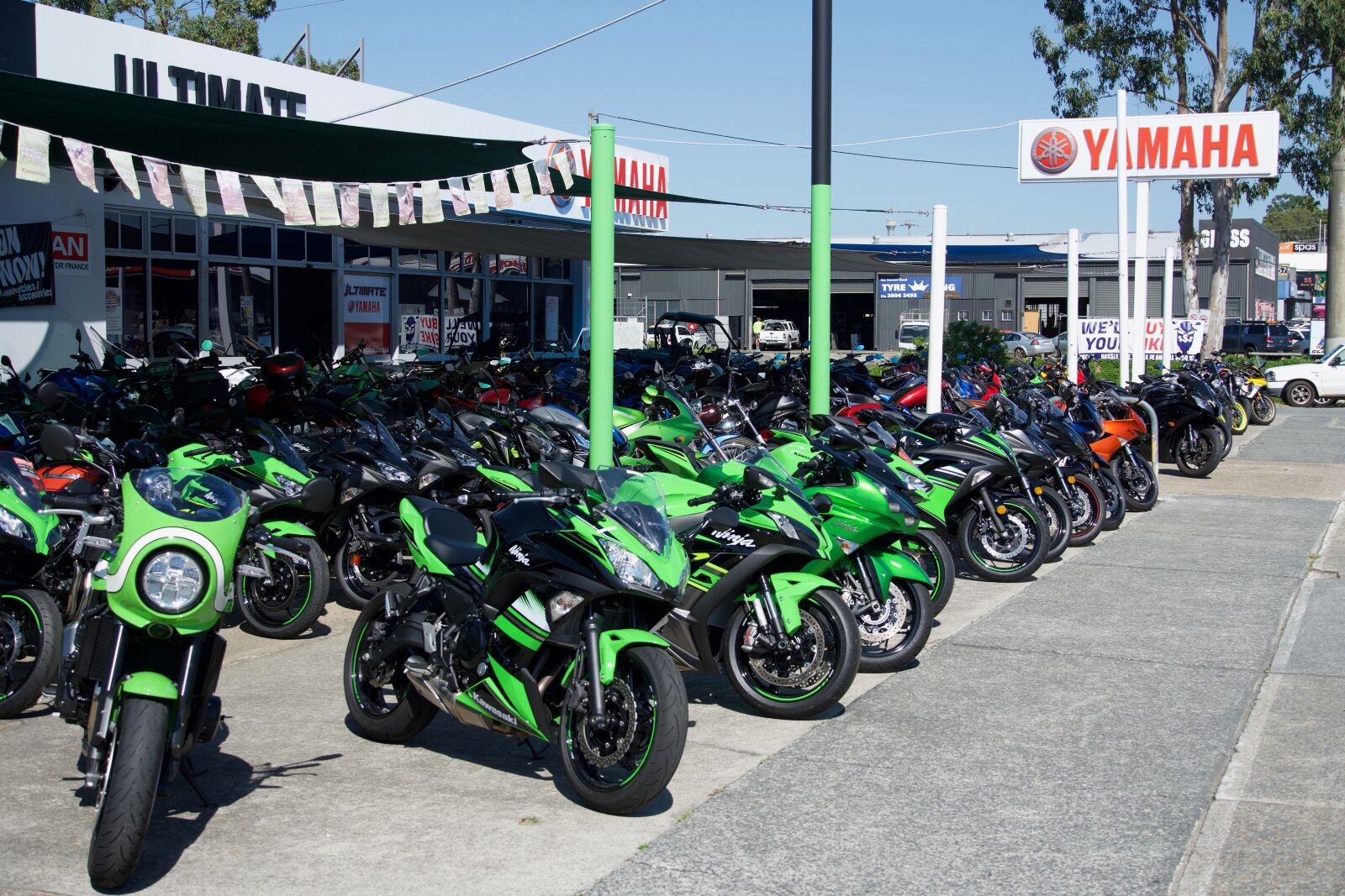 Sony E 18-135mm F3.5-5.6 OSS sample photo. Bikes, dealership, motorcycles photography