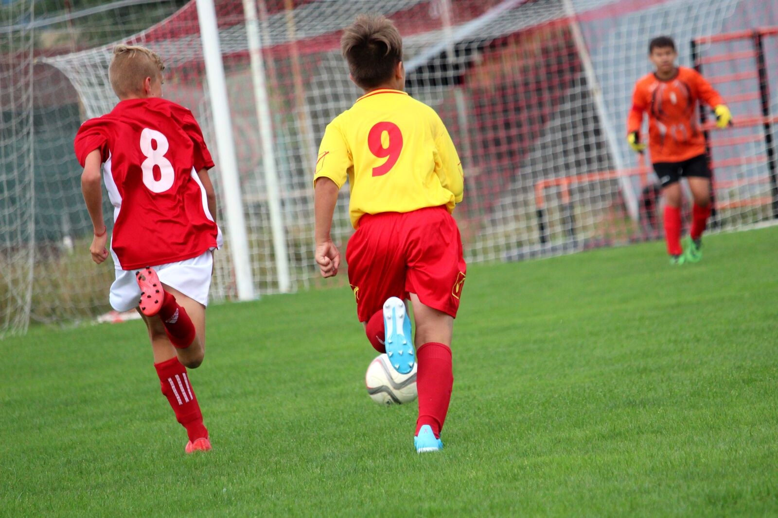 Canon EF-S 55-250mm F4-5.6 IS STM sample photo. Football, players, children photography