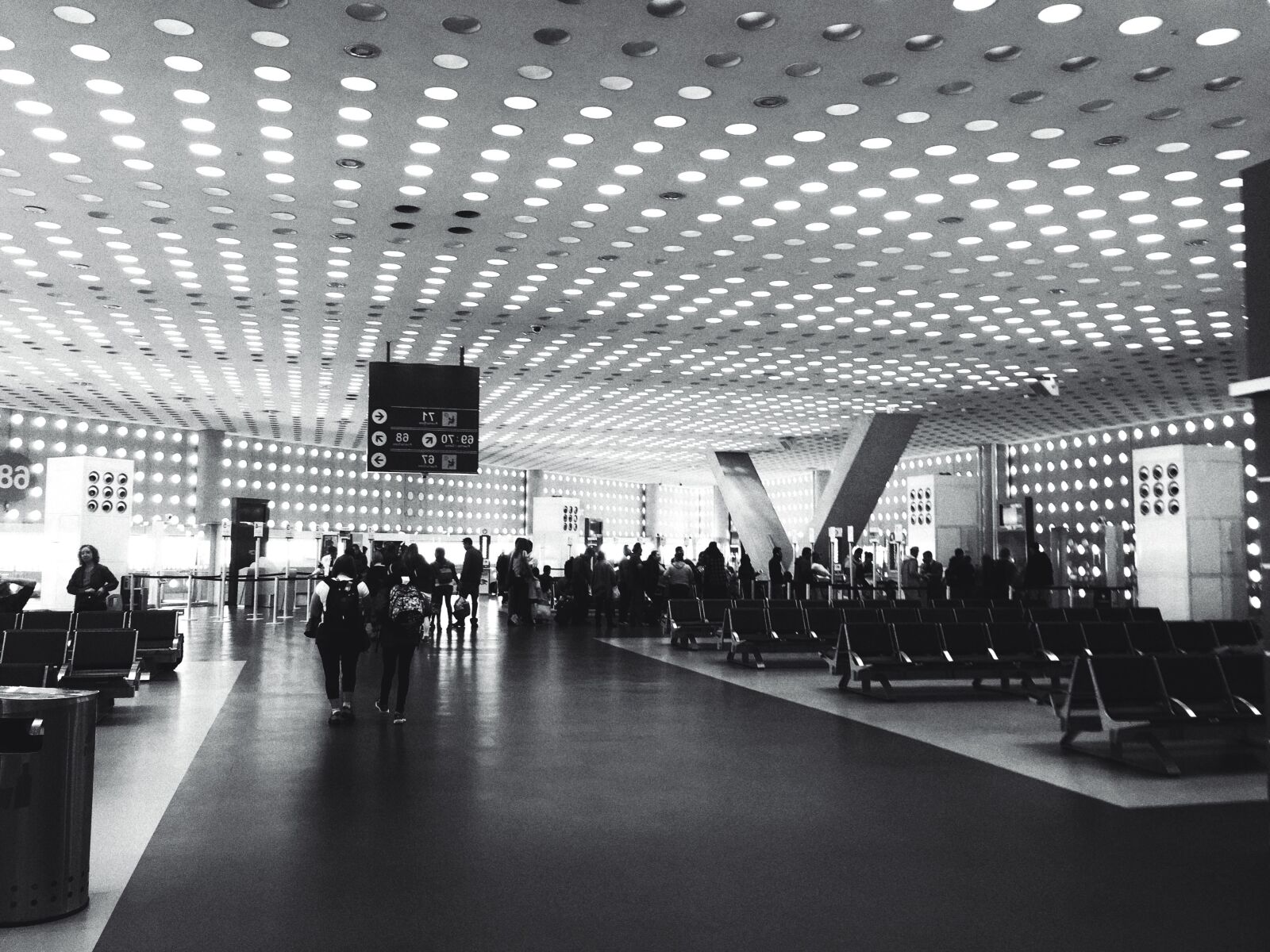 Apple iPhone 6s Plus sample photo. Airport, chairs, city, crowd photography
