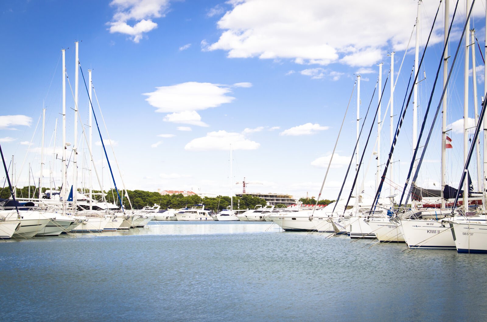 Nikon D5100 + Nikon AF-S DX Nikkor 35mm F1.8G sample photo. Bay, blue, boats, buildings photography