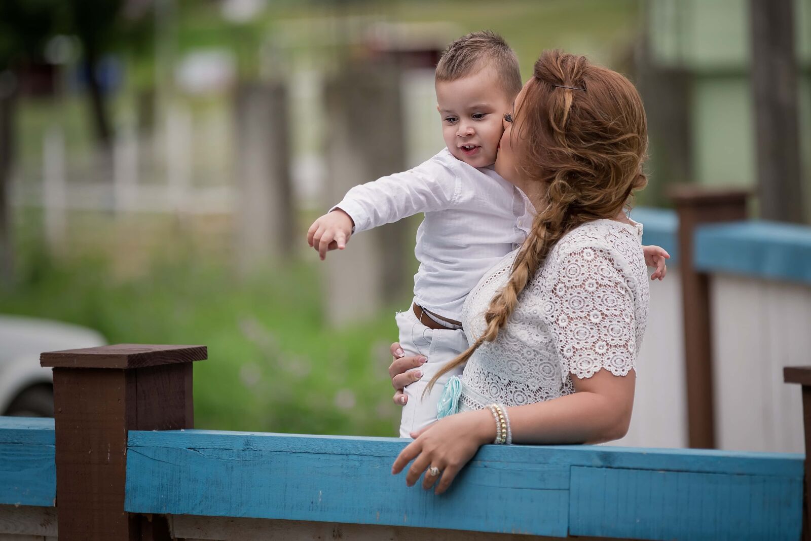 Canon EF 70-200mm F2.8L IS II USM sample photo. Mother, kiss, son, embrace photography