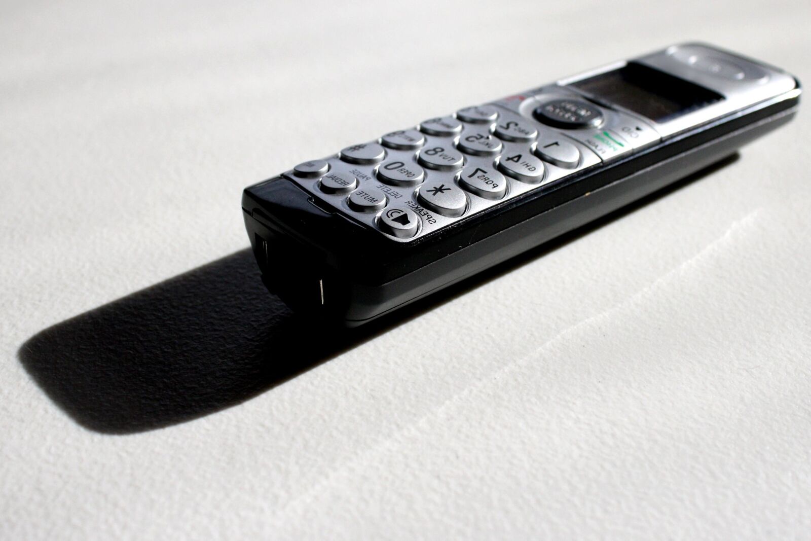 f/3.5-5.6 IS sample photo. Cordless phone, handset photography