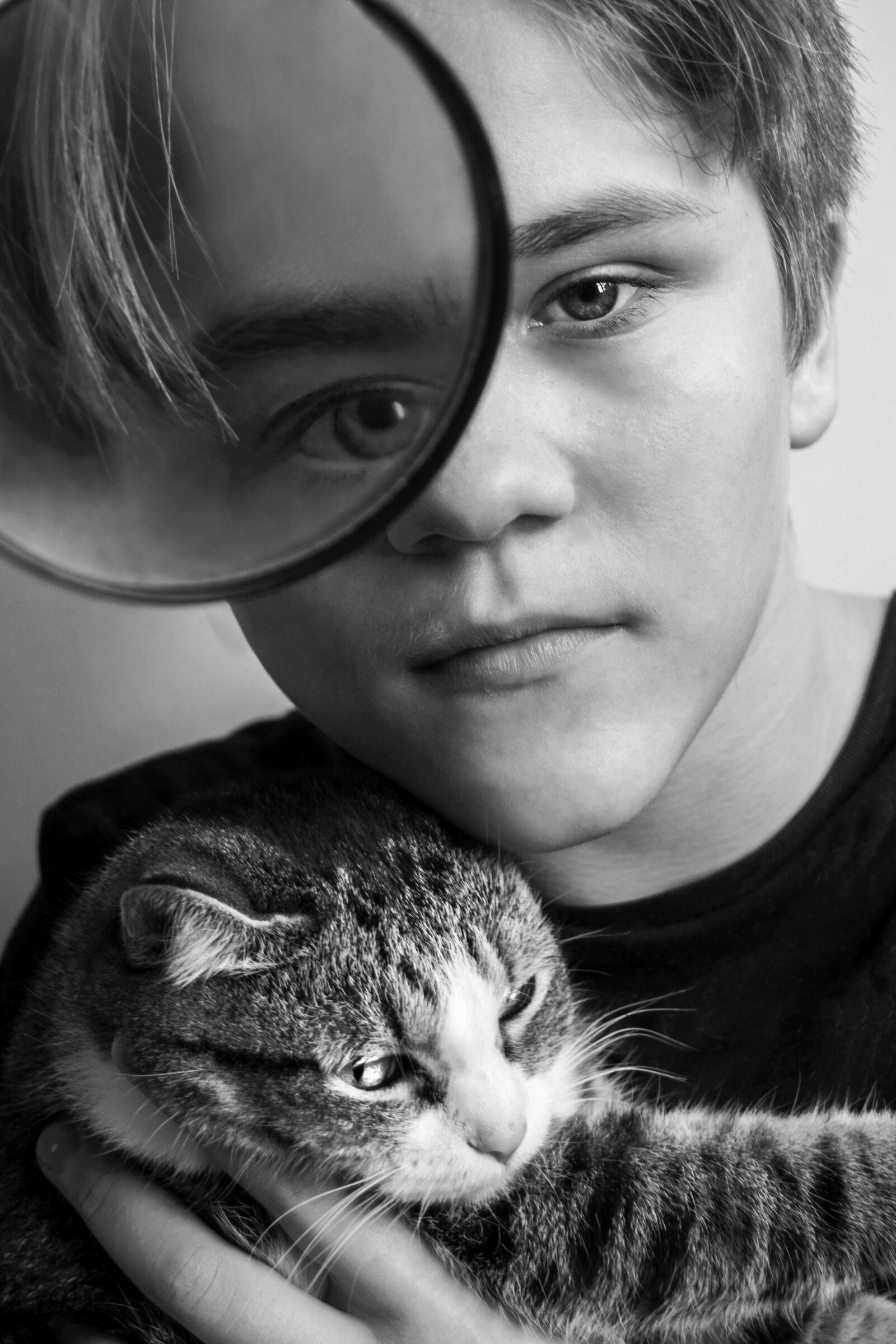 Nikon D3100 sample photo. Boy, cat, magnifier photography