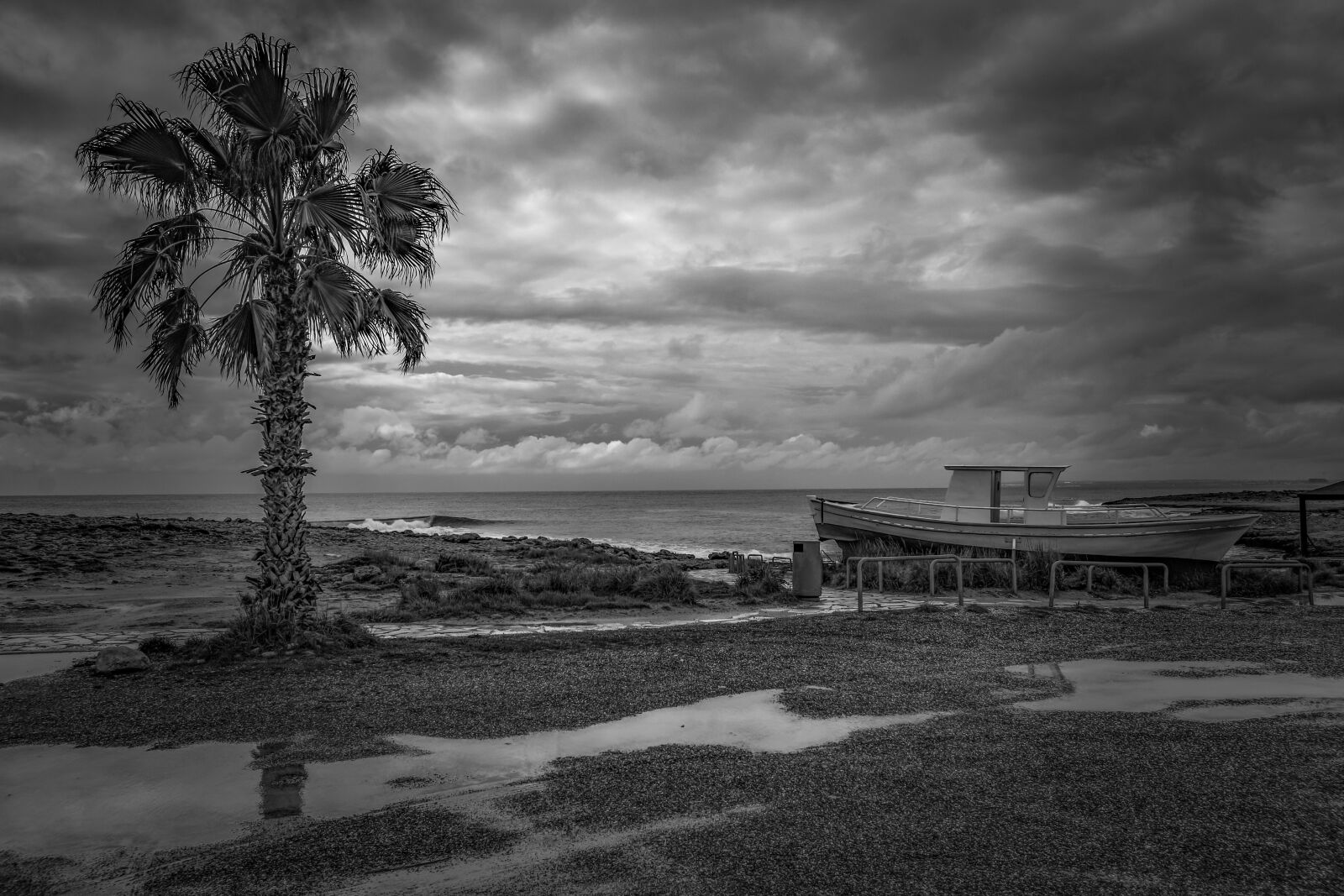 Nikon D3300 sample photo. Rainy day, beach, boat photography