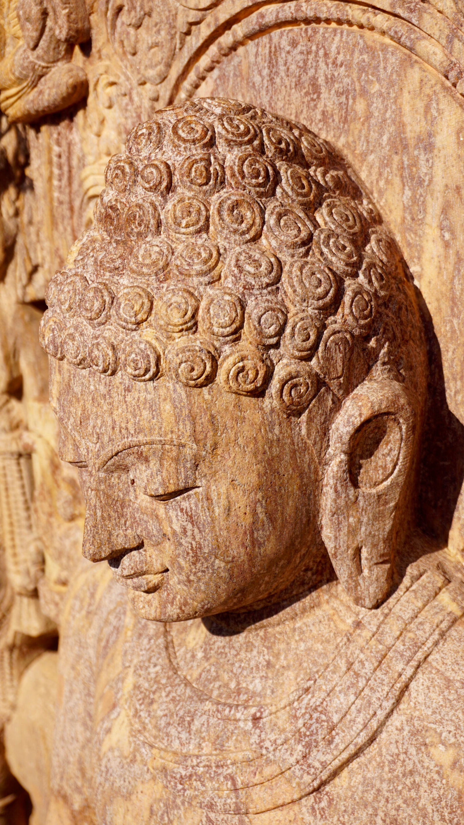 Sony a6000 + Sony E 16-50mm F3.5-5.6 PZ OSS sample photo. Buddha, bust, carving, face photography