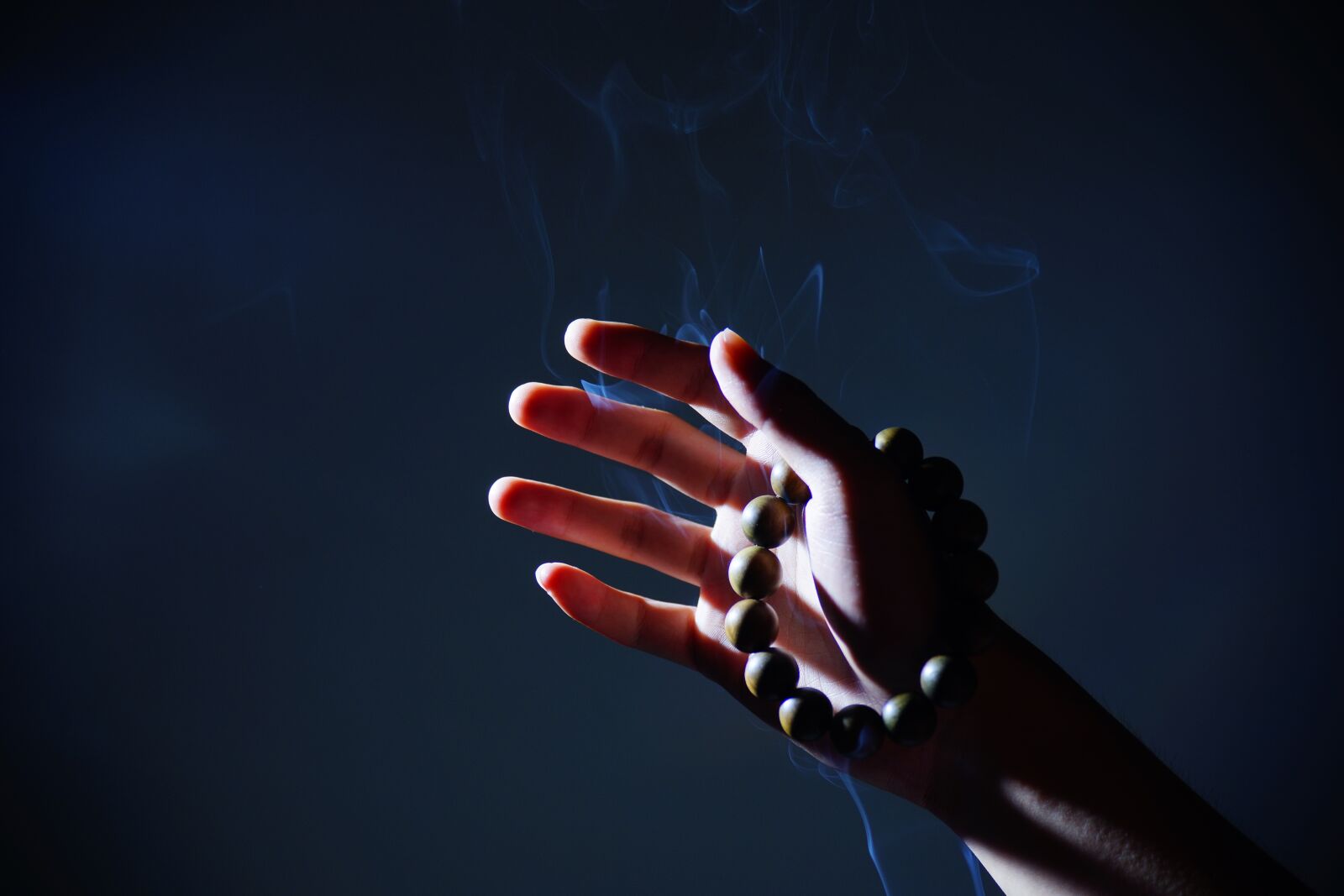 Sony a99 II sample photo. Hand, buddhist prayer beads photography