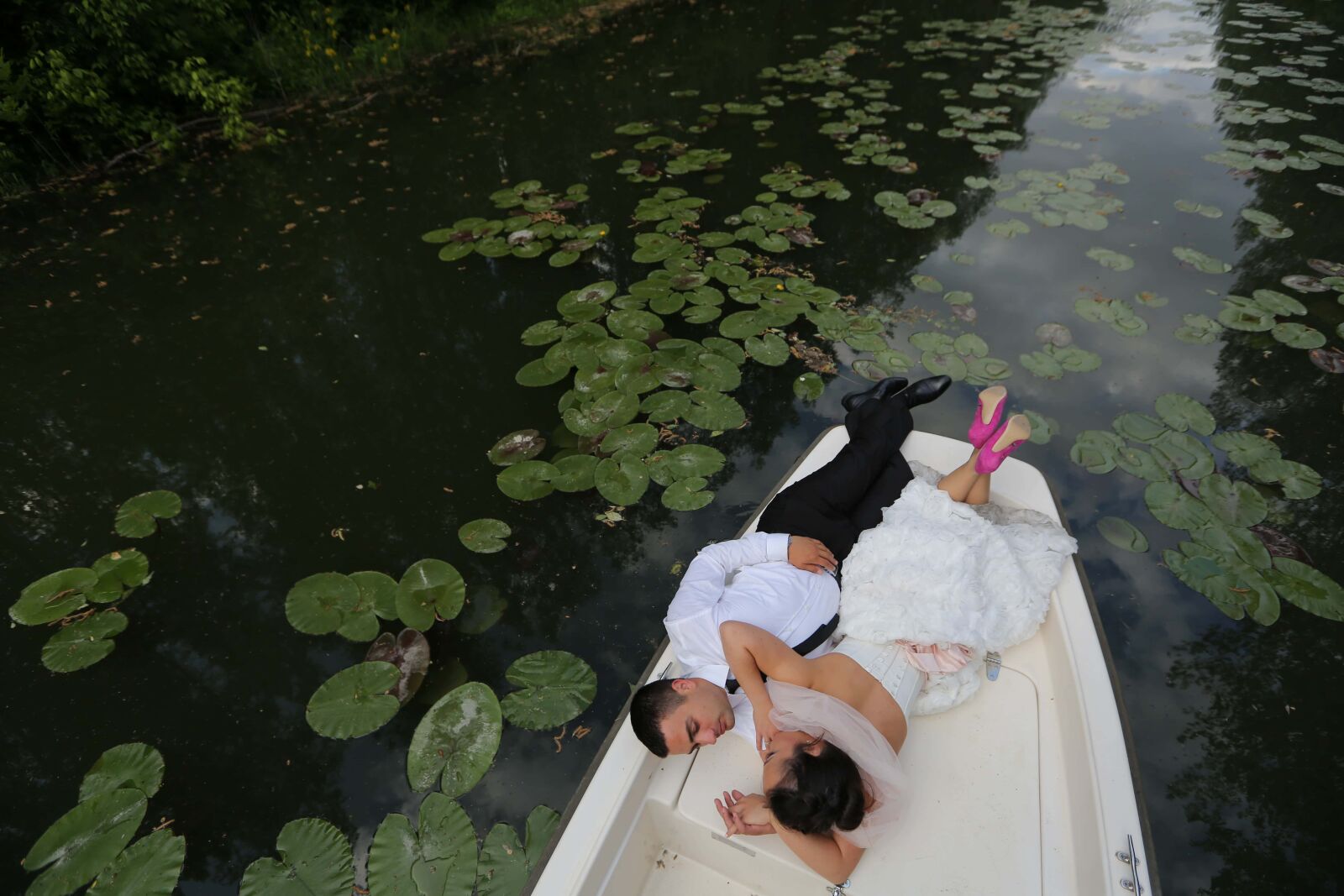 Canon EF 16-35mm F2.8L II USM sample photo. Groom, bride, lily pad photography