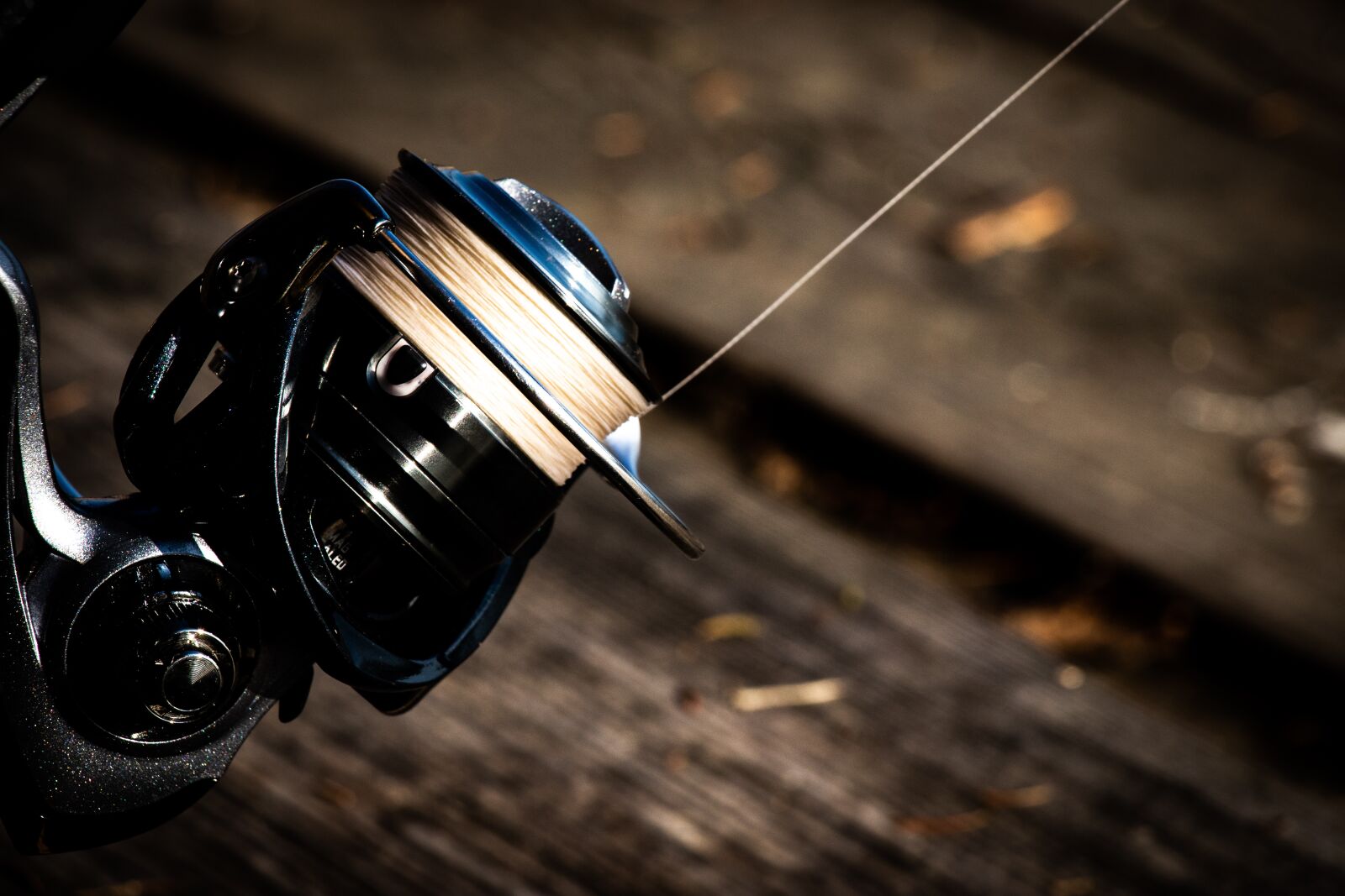 Canon EF-S 18-135mm F3.5-5.6 IS USM sample photo. Fishing, spinning rod, brown photography