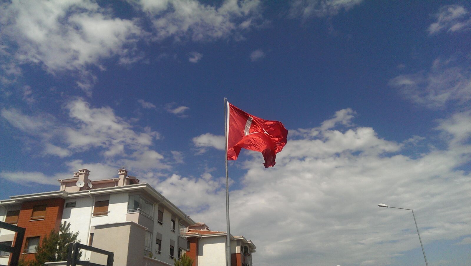 HTC ONE sample photo. Gray, metal, flag, post photography