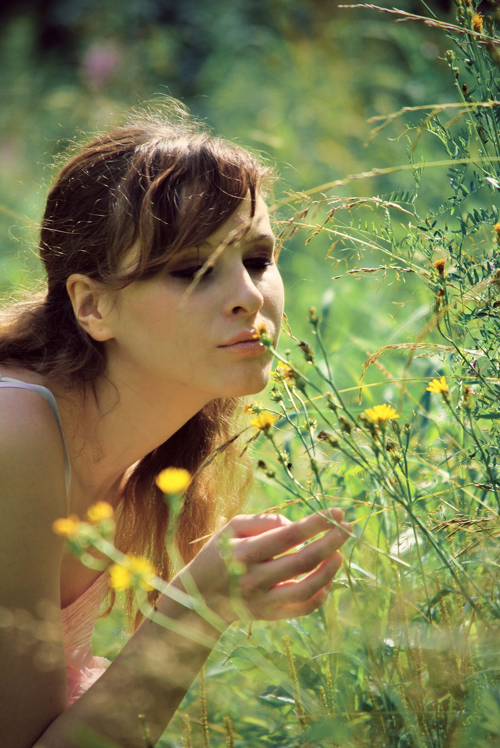 Nikon D3000 sample photo. Woman smelling flowers, the photography