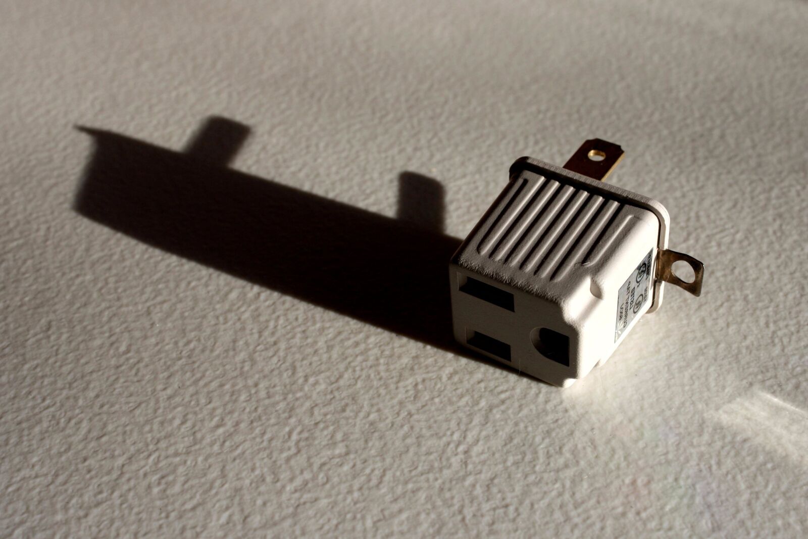 f/3.5-5.6 IS sample photo. Prong converter plug photography