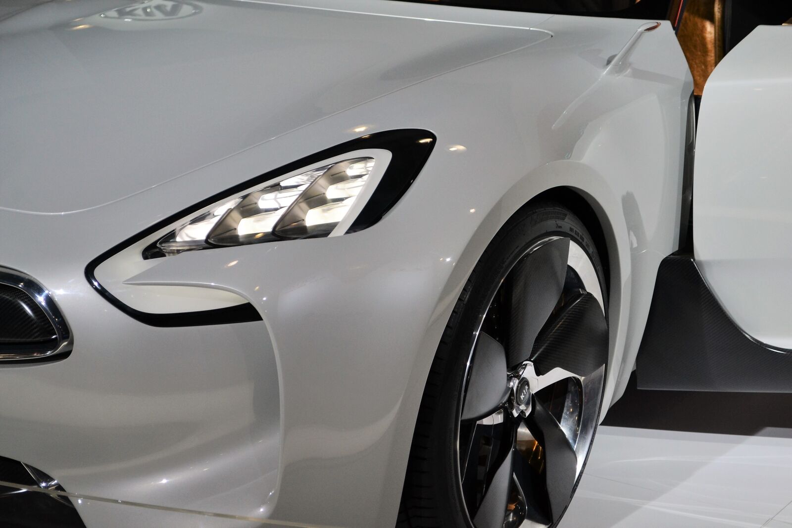 Nikon D3100 sample photo. Kia sports car, white photography