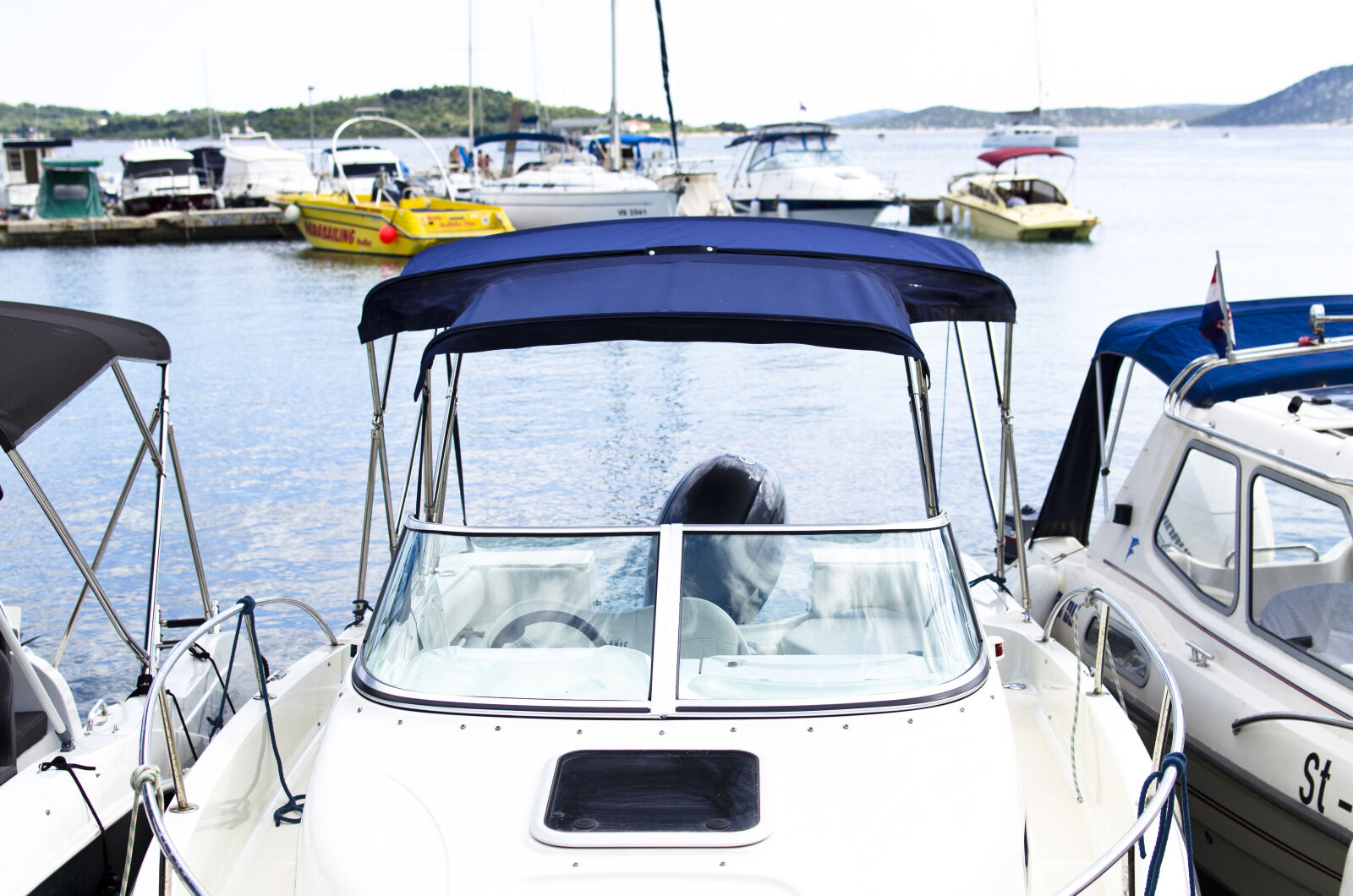 Nikon D5100 + Nikon AF-S DX Nikkor 35mm F1.8G sample photo. Bay, beach, blue, boats photography