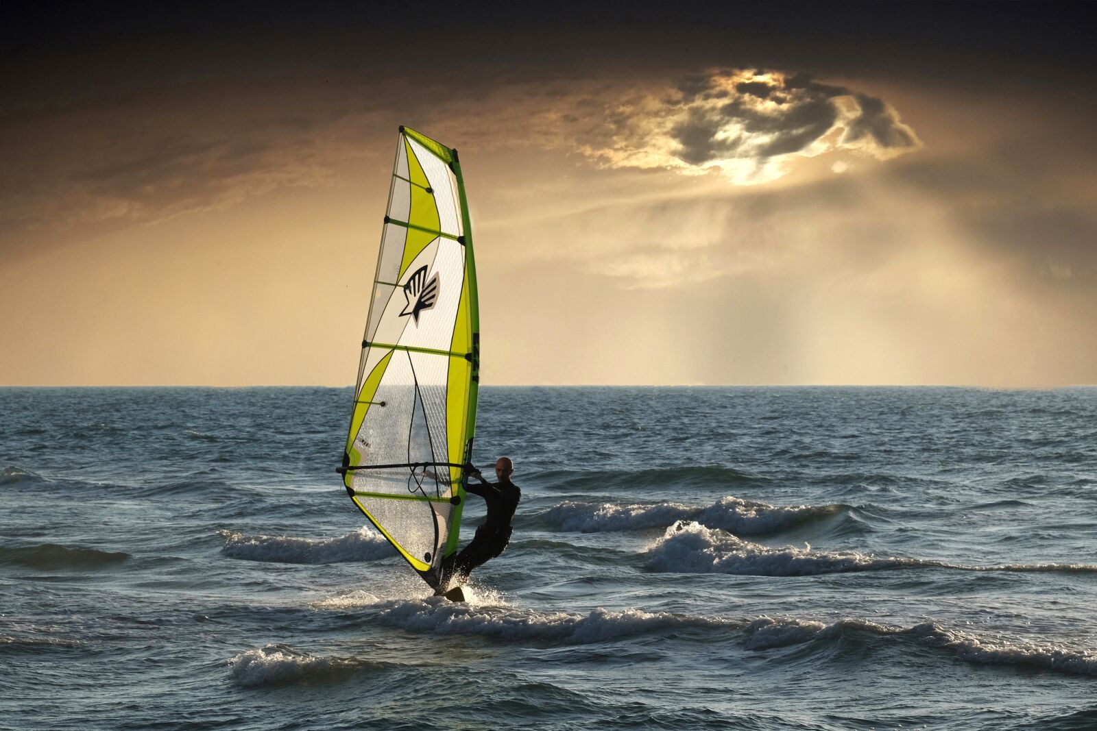Fujifilm X-T10 sample photo. Windsurfing, sea, clouds photography