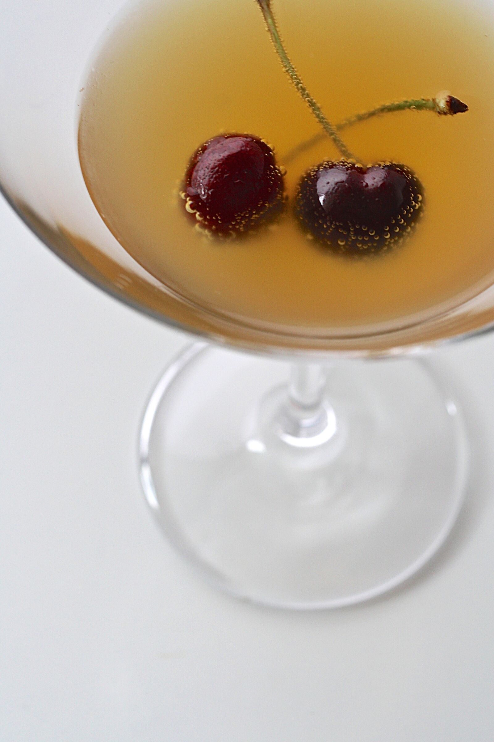 Canon EOS 1000D (EOS Digital Rebel XS / EOS Kiss F) sample photo. Cherry, drink, martini photography