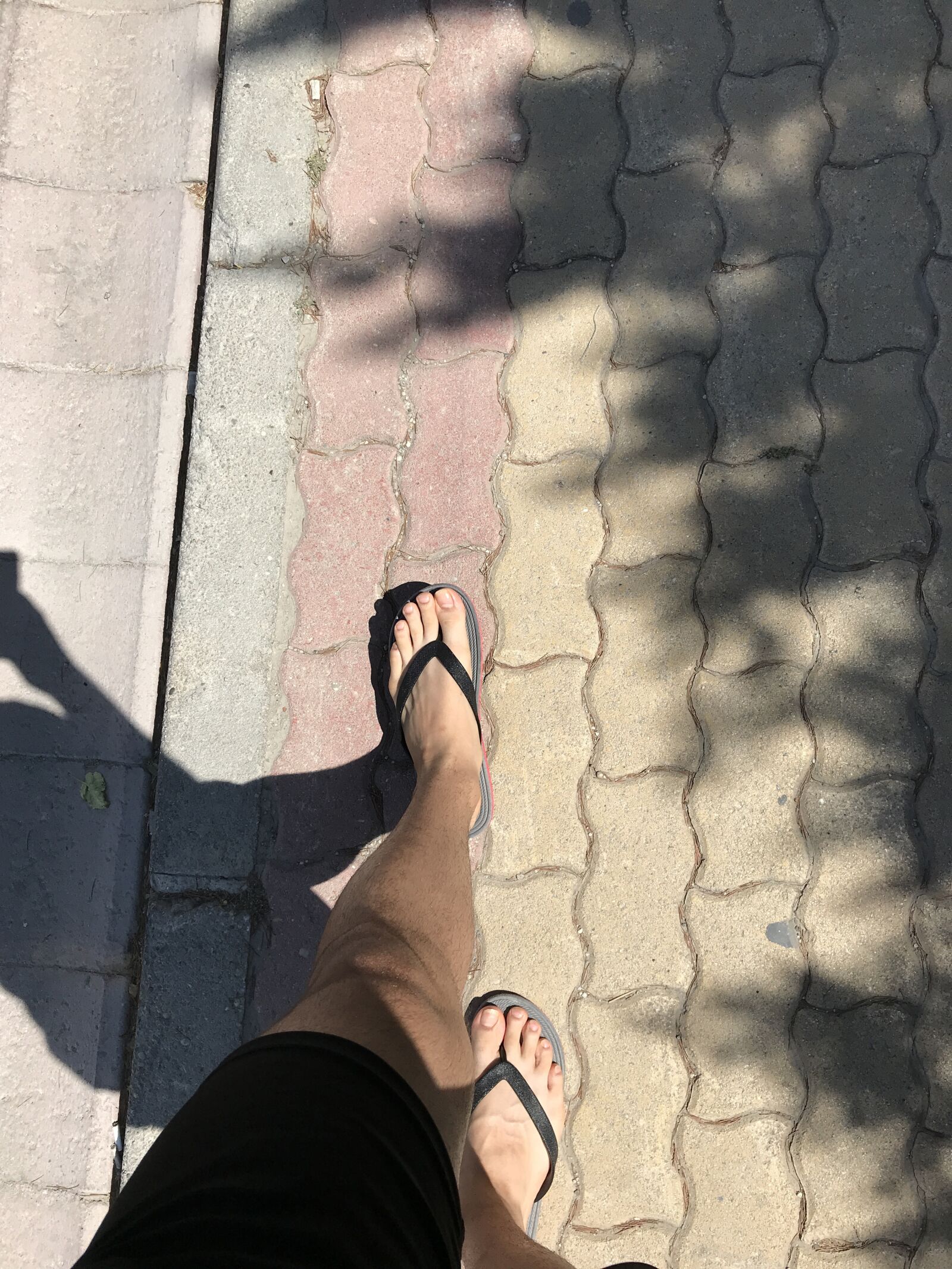 iPhone 7 back camera 3.99mm f/1.8 sample photo. Toes, boy, street photography
