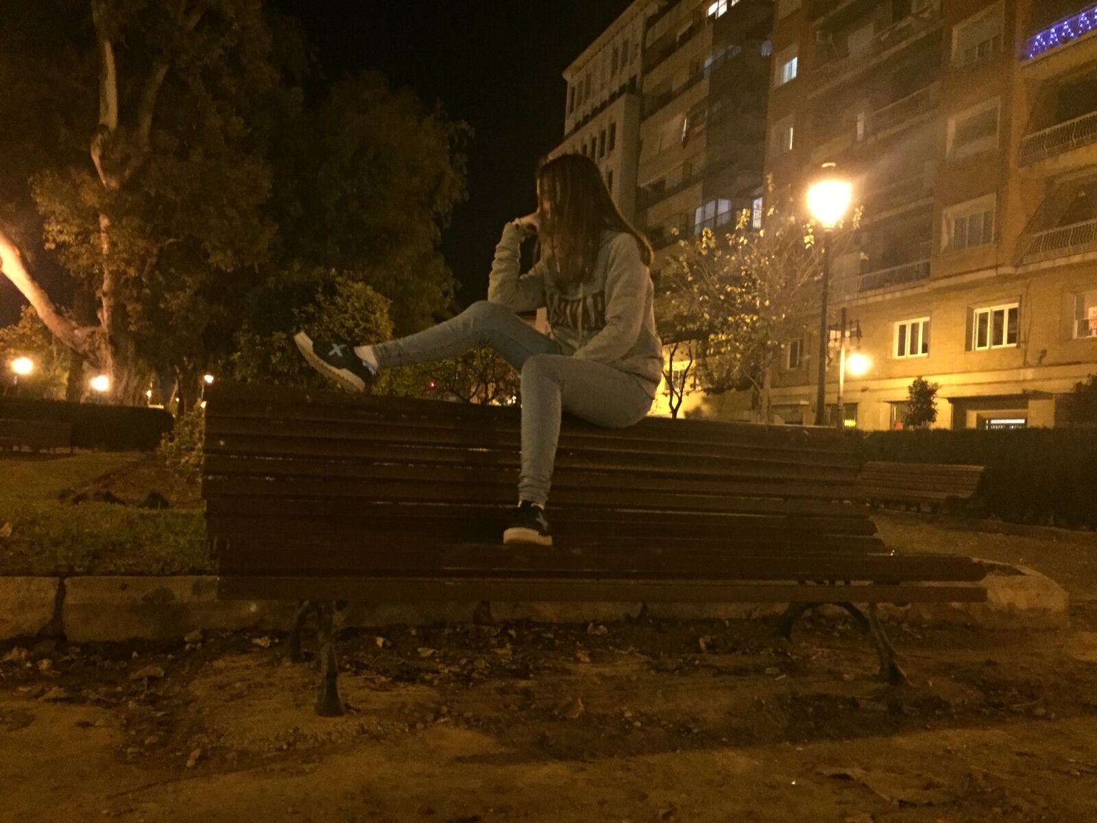 iPhone 6 back camera 4.15mm f/2.2 sample photo. Bank, person, night photography
