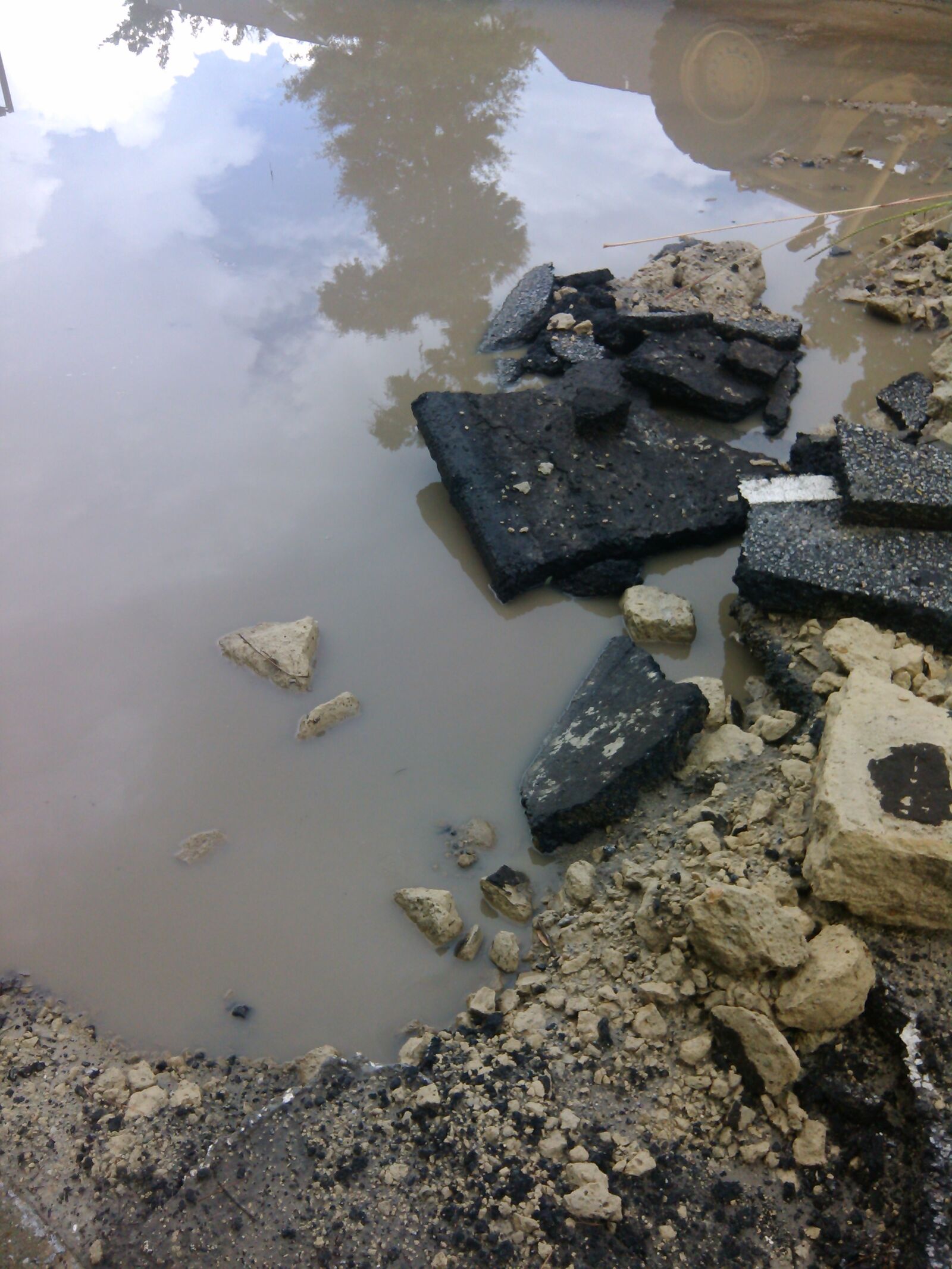 QCOM-AA QCAM-AA sample photo. Broken, concrete, dirt, gravel photography