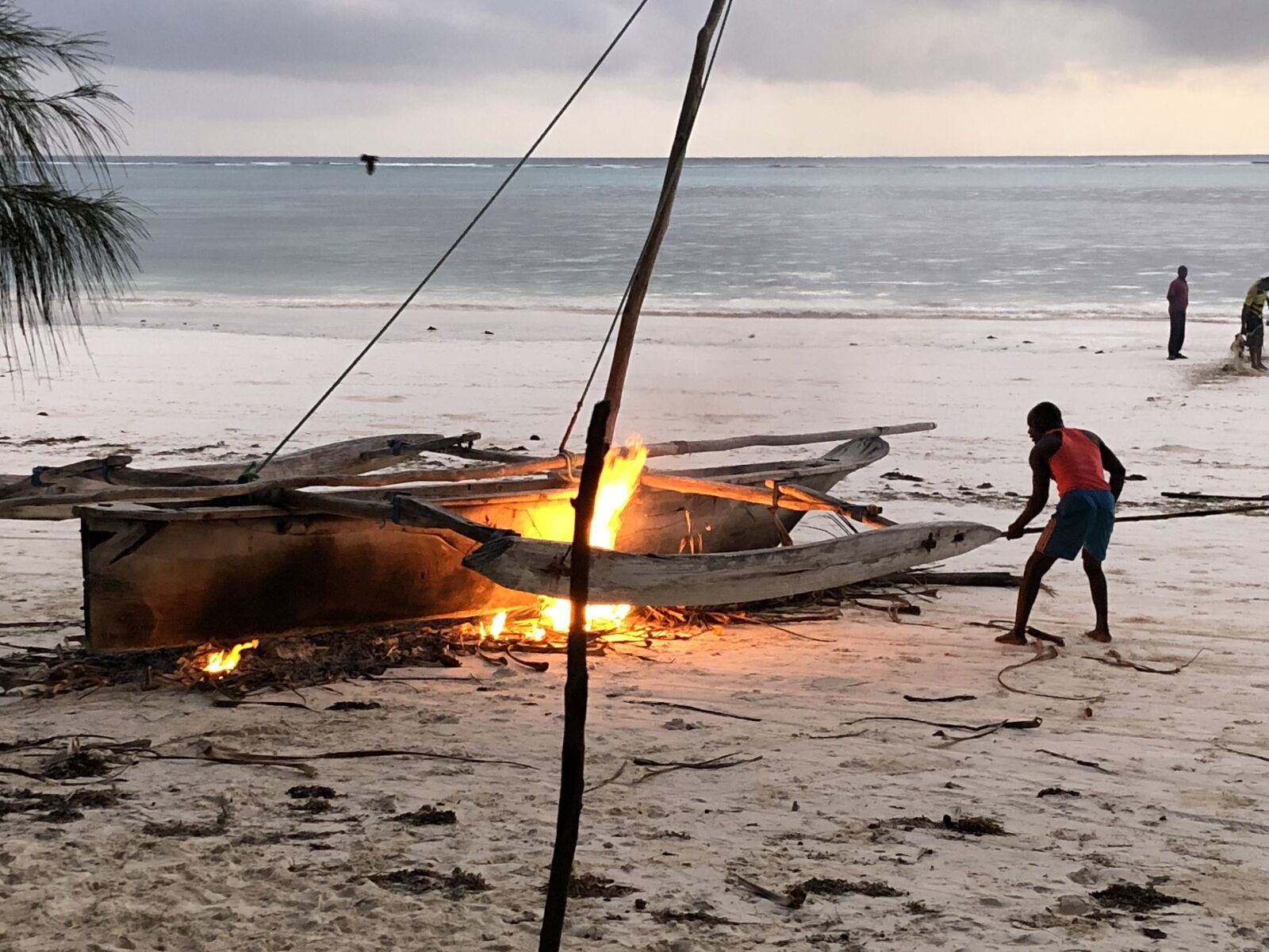 iPhone X back dual camera 4mm f/1.8 sample photo. Tanzania, boat, fire photography