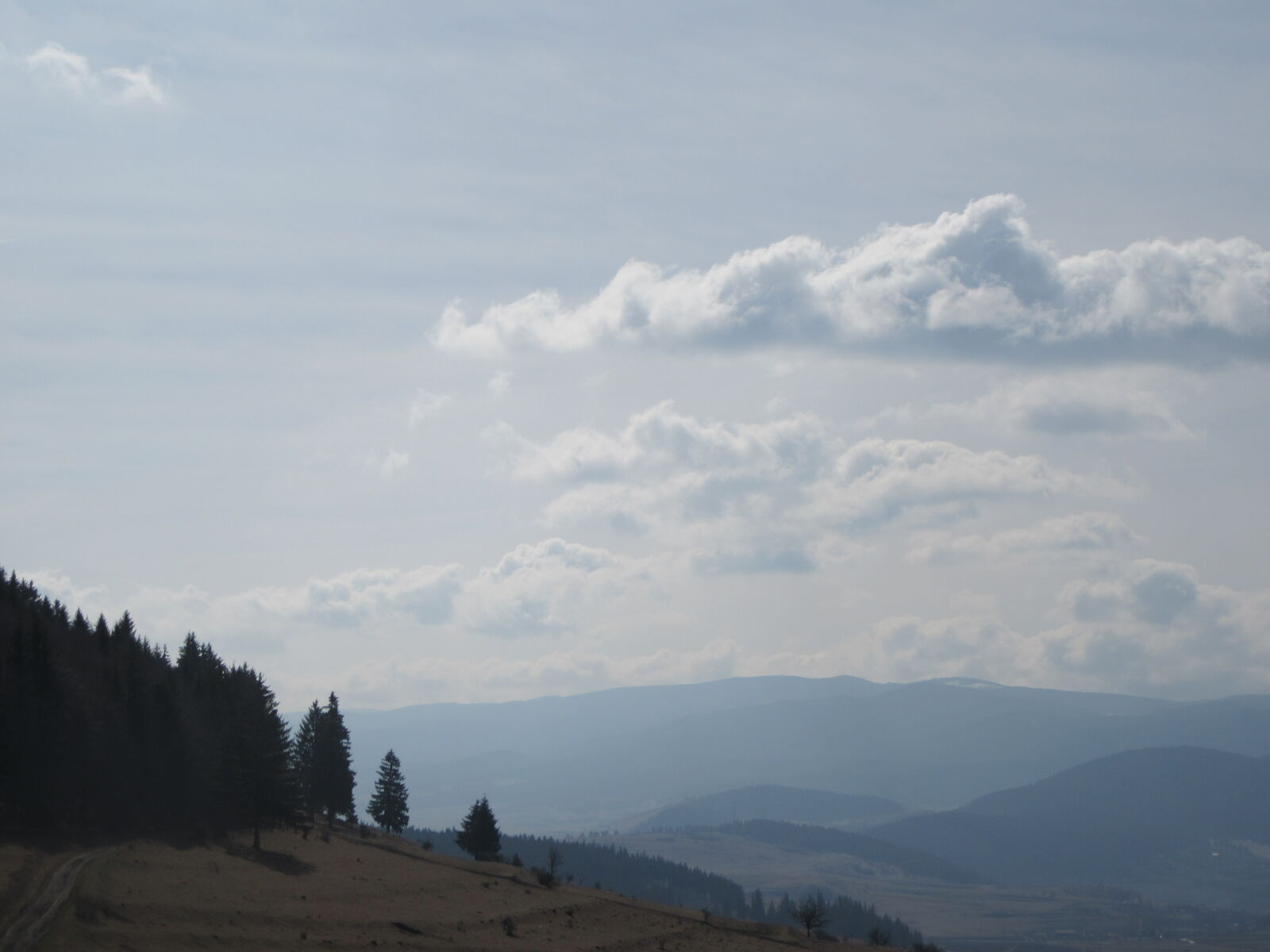 Canon PowerShot SX610 HS sample photo. Clouds, blue, mountains photography