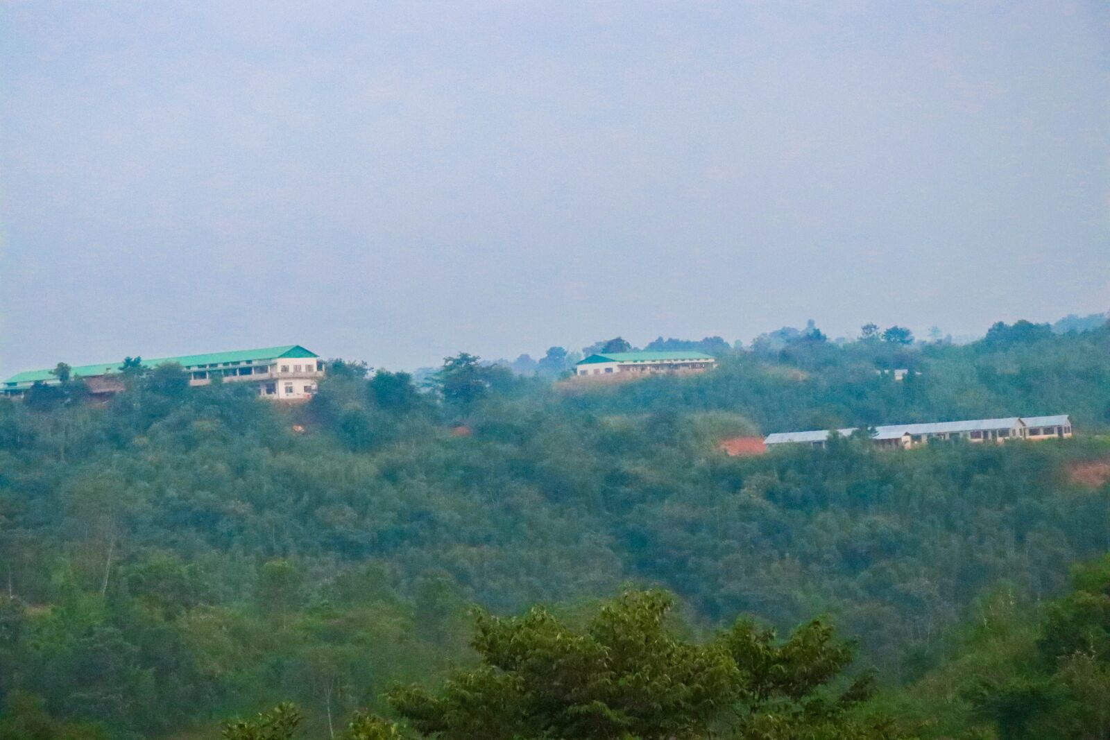 Canon EOS 80D sample photo. Mountain, building, trees photography